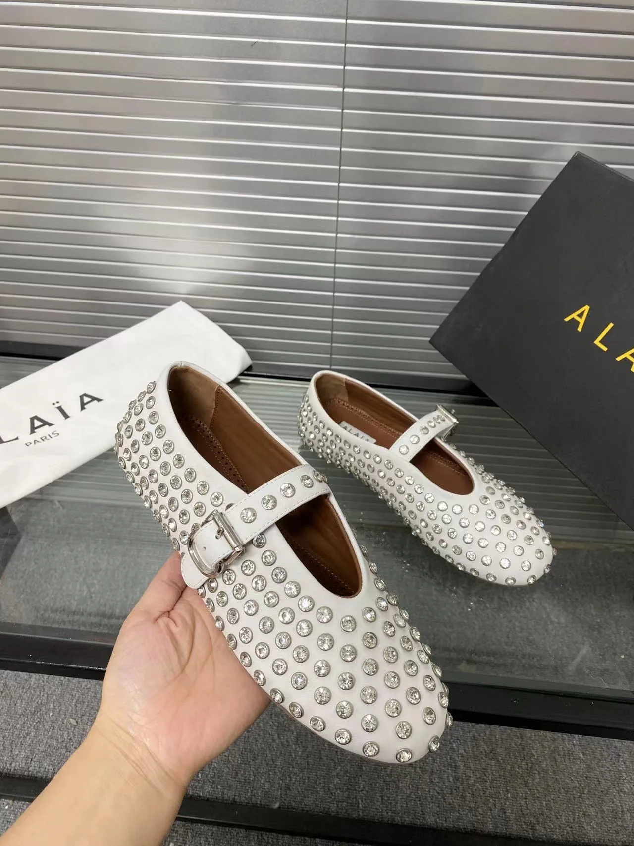 Alaia Cowhide Sheepskin Glossy Round-Toe Buckle Studded Mary Jane Flats in White · view 5