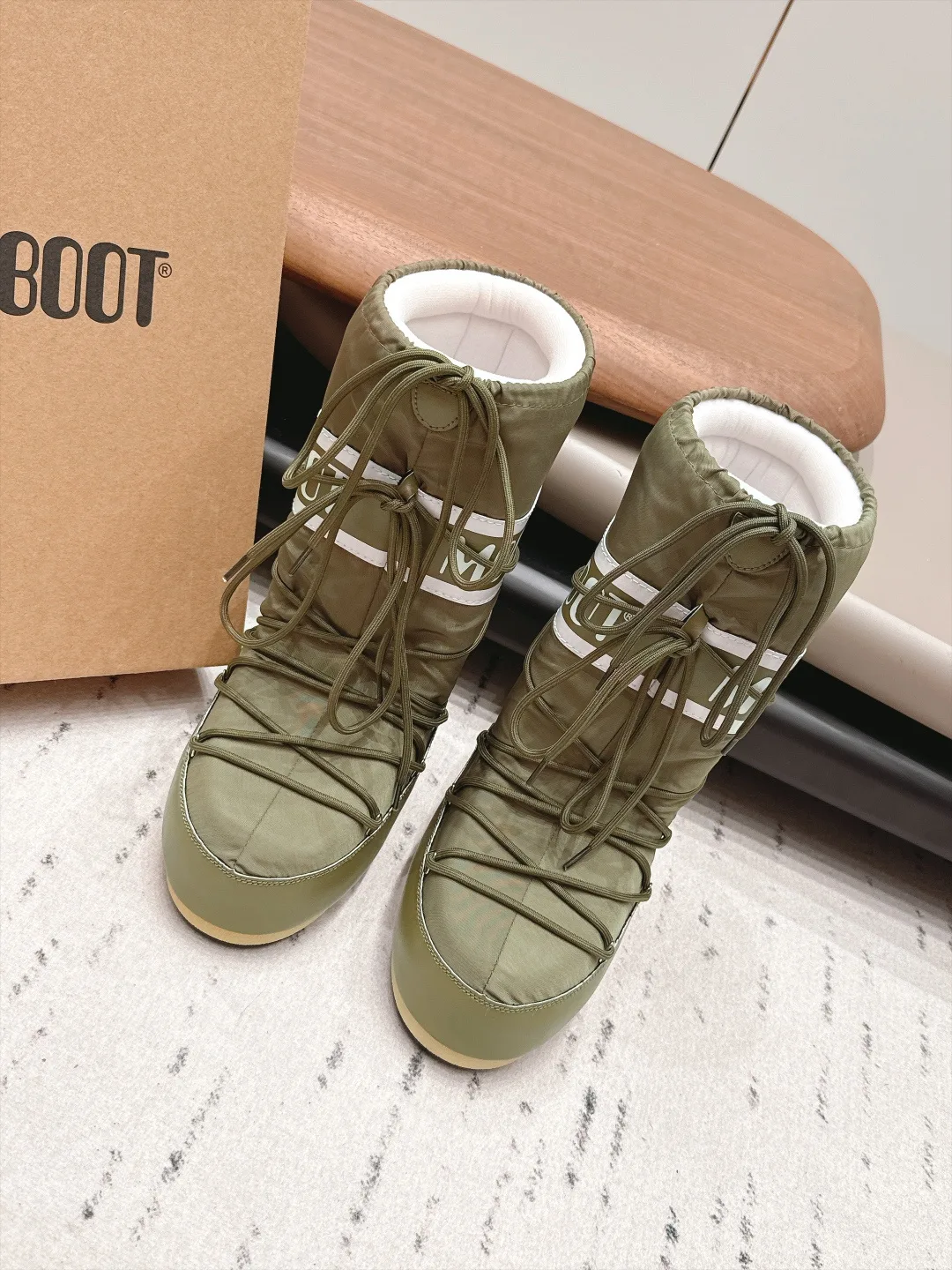 Moon Boot Quilted Boots in Green · view 1