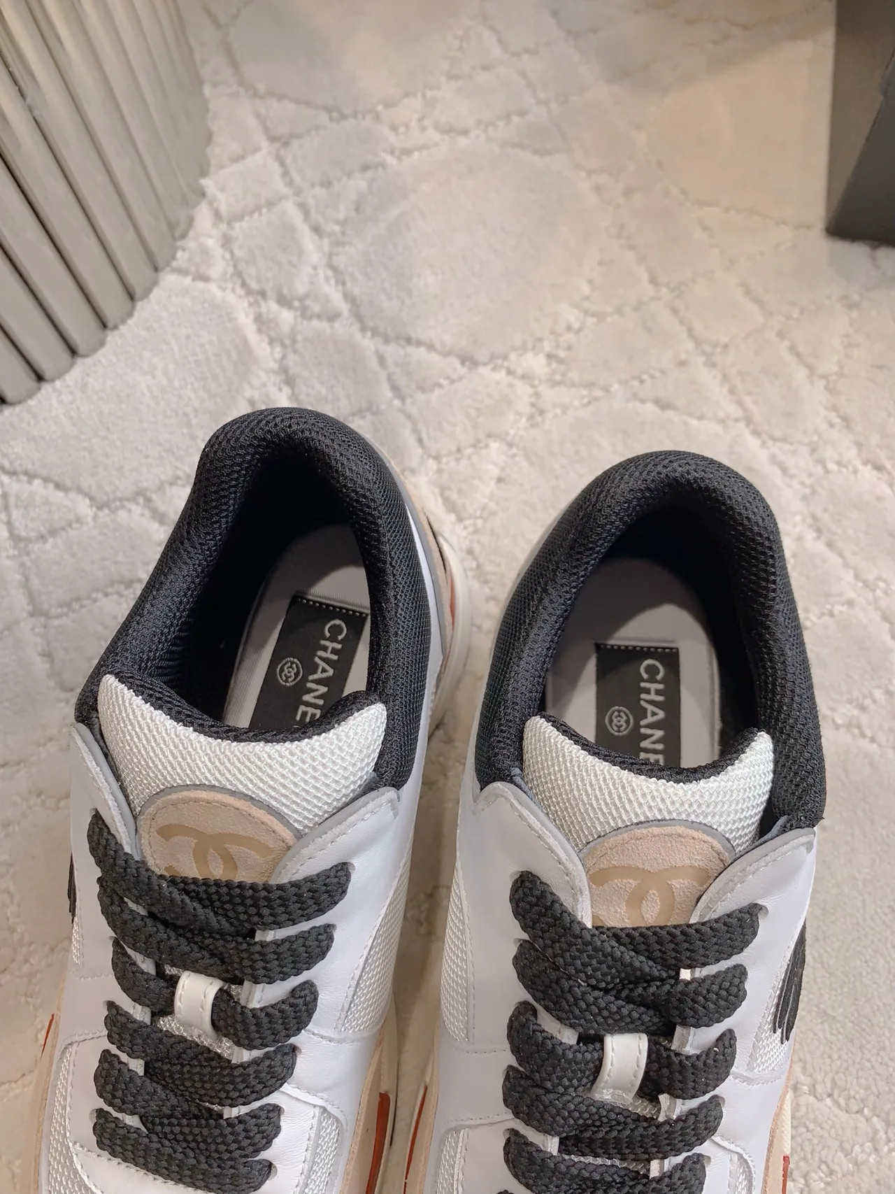Chanel Quilted Sneakers in White · view 8