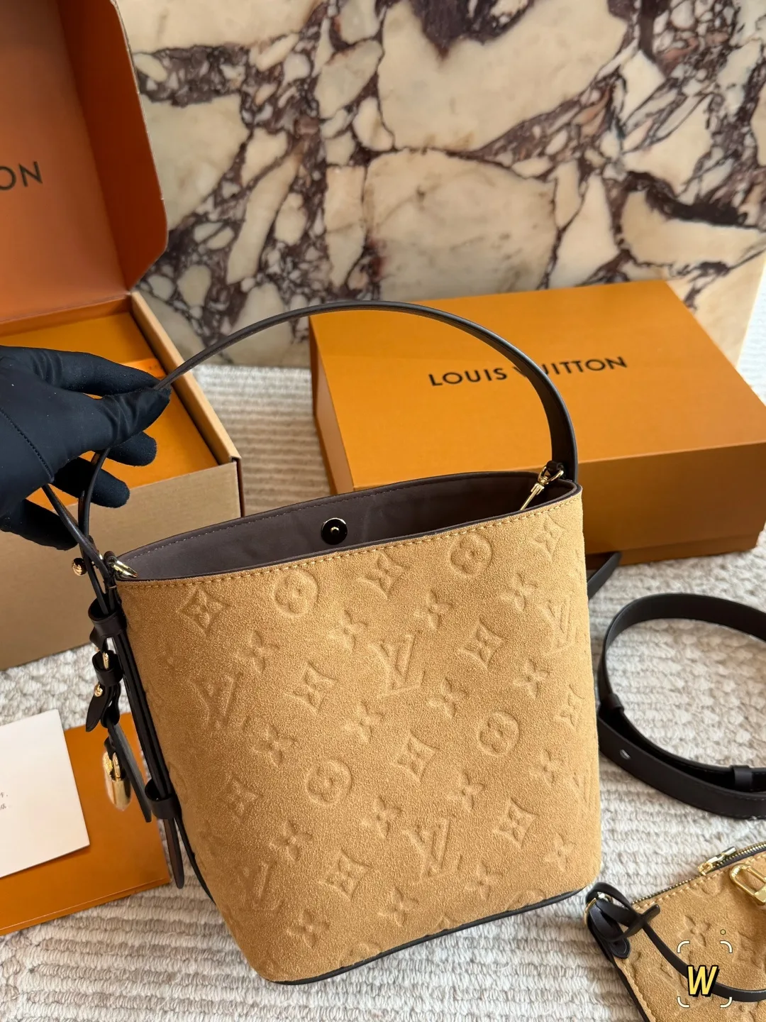 Louis Vuitton Suede Monogram Bucket Bag in Tan · view 1