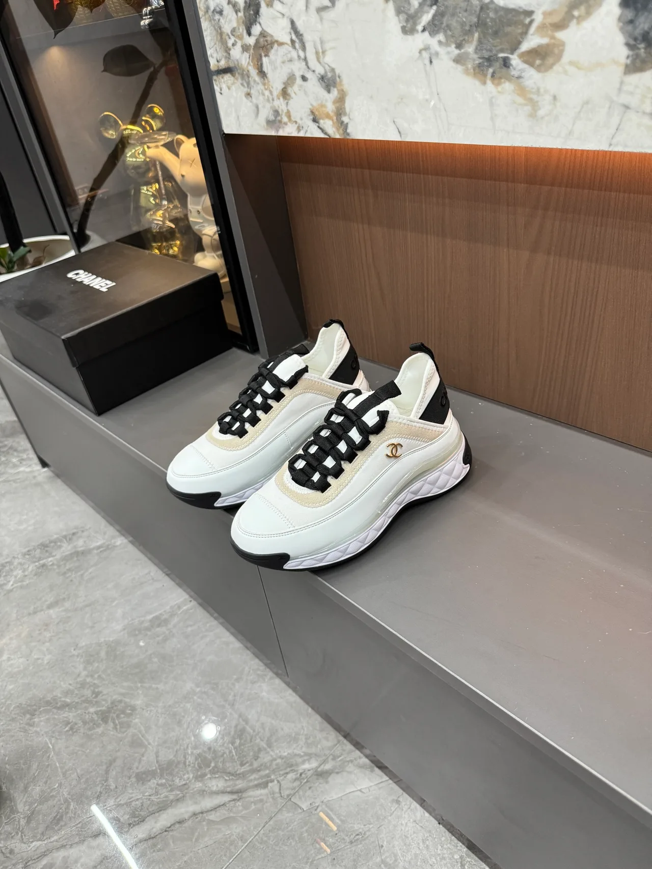 Chanel Cowhide Quilted Lace-Up Sneakers in White · view 1