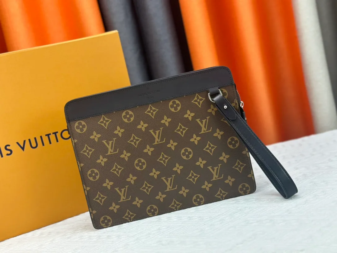 Louis Vuitton Canvas Clutch in Brown · view 1