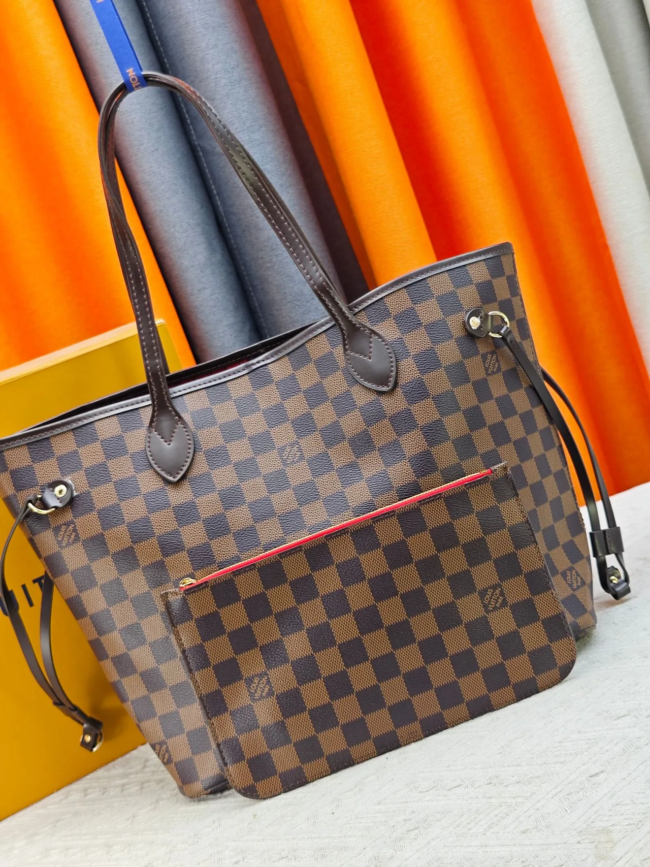 Louis Vuitton Neverfull Clutch in Brown · view 1