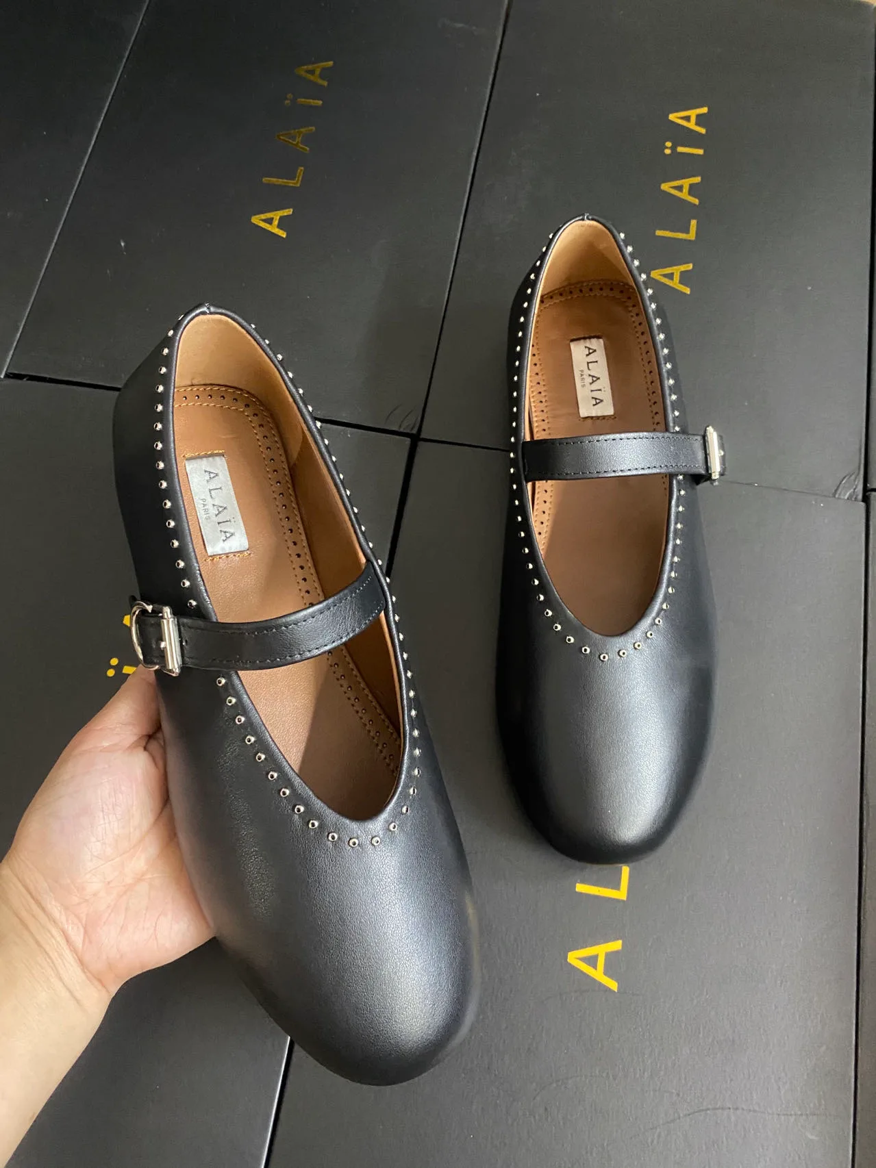Alaia Cowhide Sheepskin Smooth Round-Toe Mary Jane Flats in Black · view 4