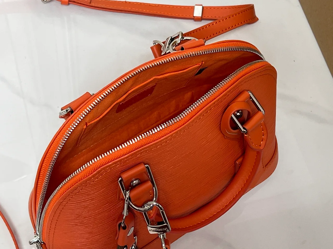 Louis Vuitton Leather Handbag in Orange · view 8