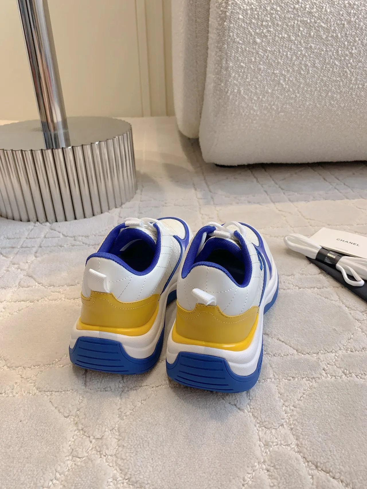 Chanel Quilted Sneakers in White · view 8