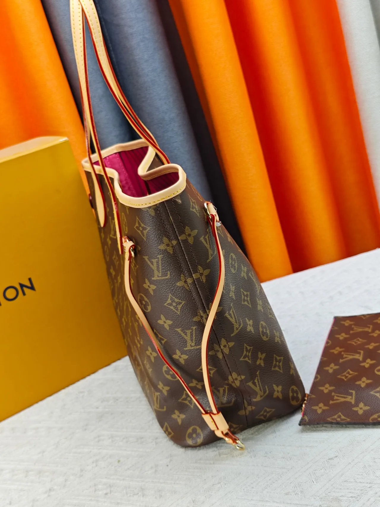 Louis Vuitton Neverfull Clutch in Brown · view 5