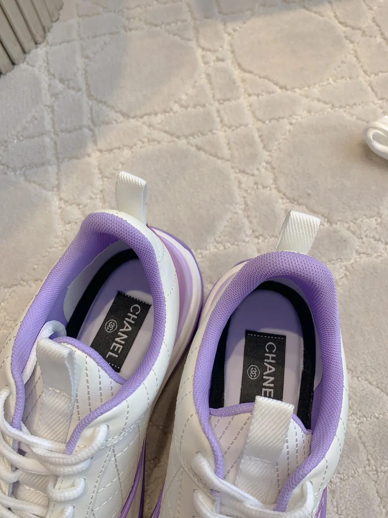 Chanel Quilted Sneakers in White · view 6