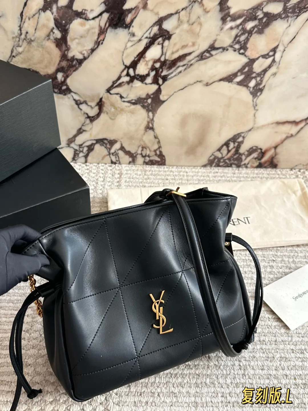 Saint Laurent Bucket Bag in Black / Burgundy / White / Brown · view 1