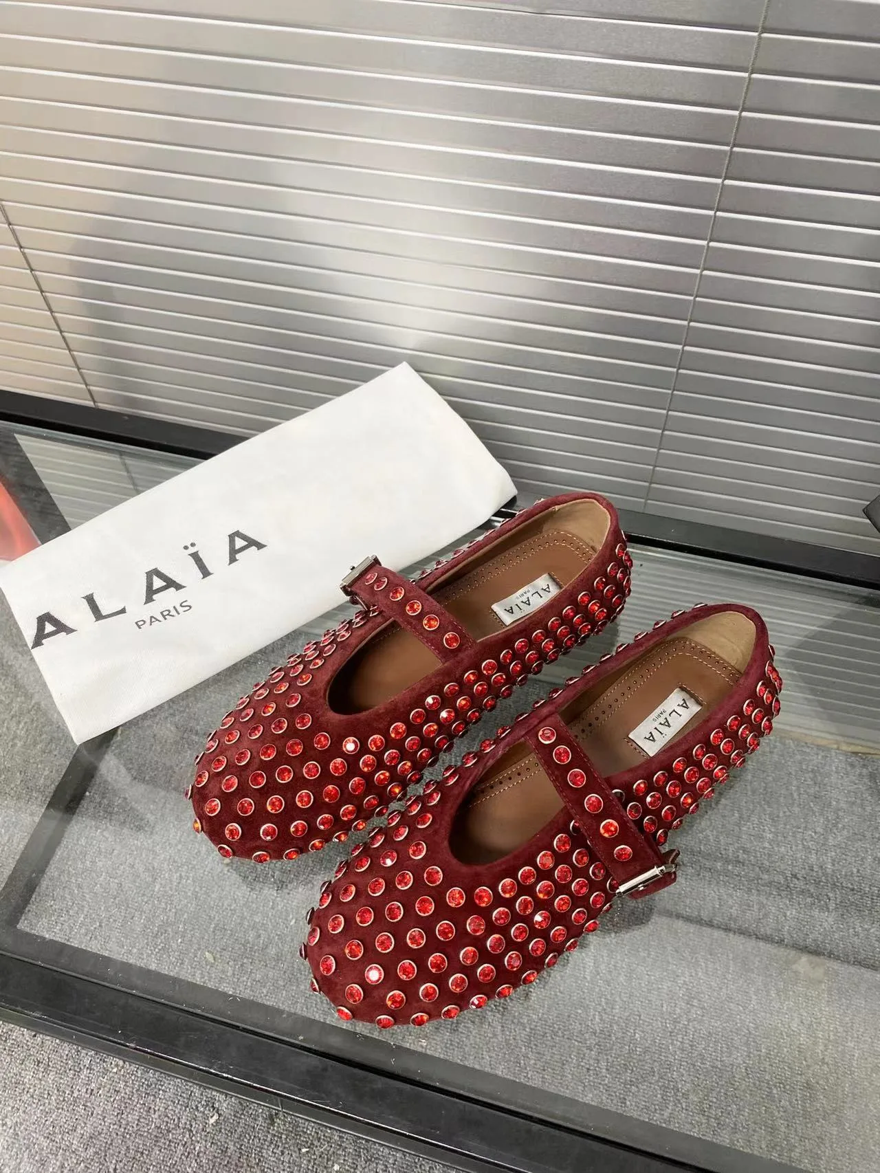 Alaia Cowhide Sheepskin Glossy Round-Toe Ballet Flats in Burgundy · view 1
