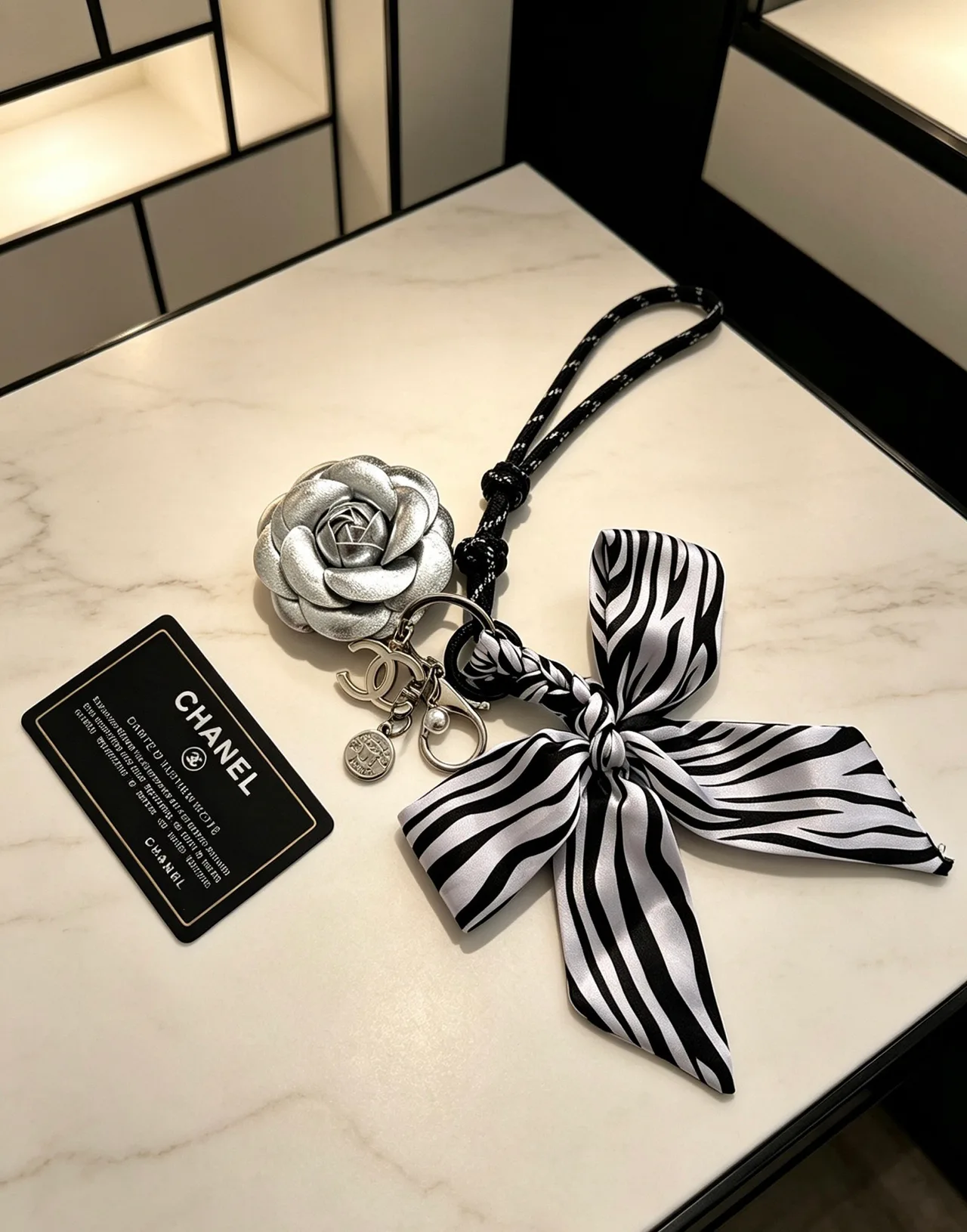 Chanel Striped Camellia Keychain in Silver · view 4
