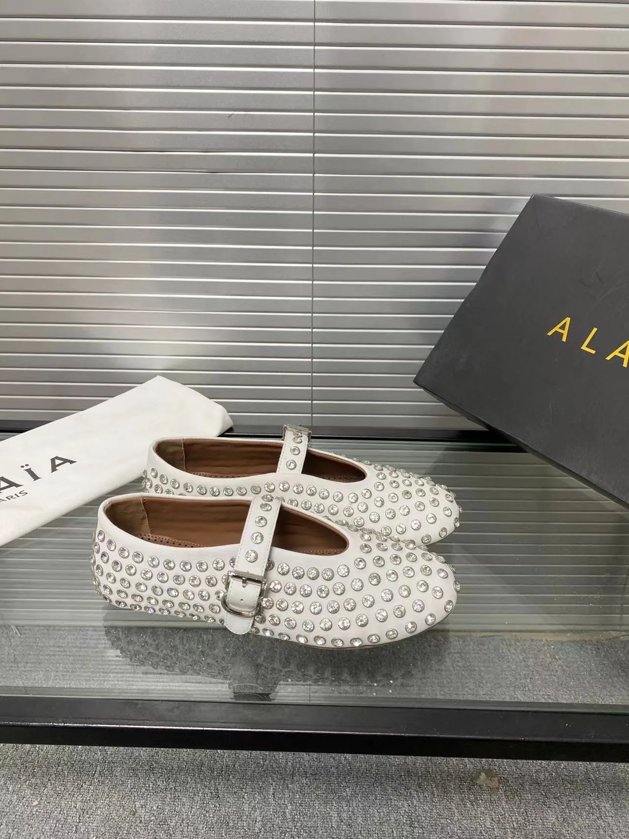 Alaia Cowhide Sheepskin Glossy Round-Toe Buckle Studded Mary Jane Flats in White · view 3