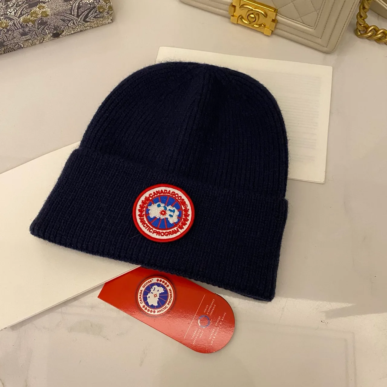 Canada Goose Ribbed beanie in Blue & White & Red & Grey & Black & Cream & Pink & Yellow & Orange & Brown · view 1
