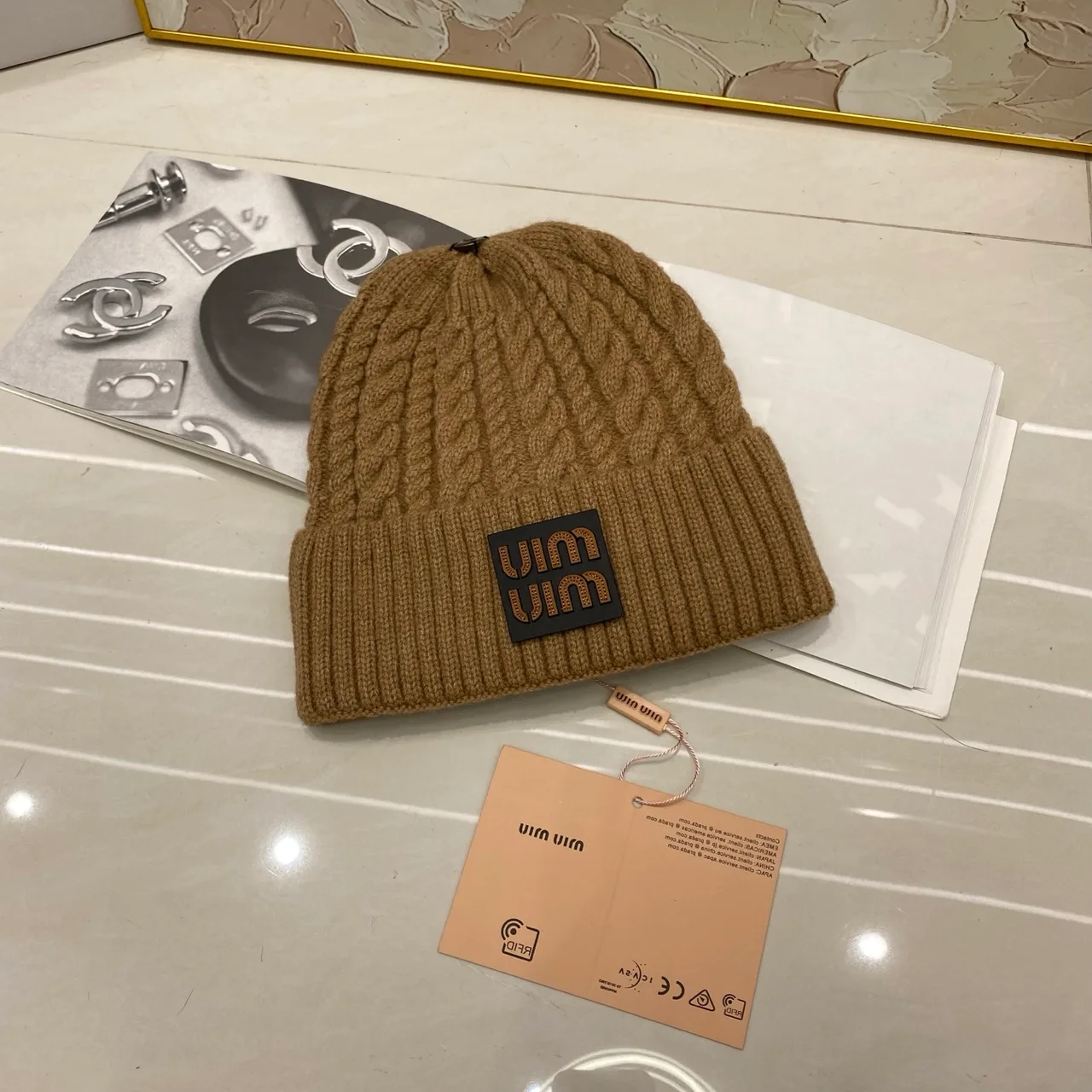 Miu Miu Cable-knit logo beanie in Black & White & Grey & Tan & Cream & Burgundy & Brown · view 4