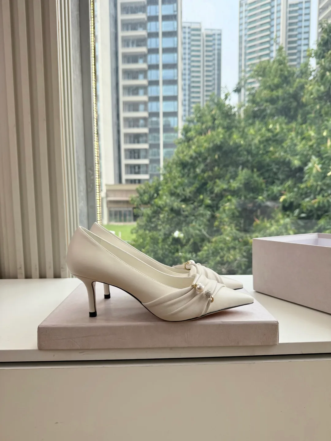 Jimmy Choo Glossy Pointed-Toe Knotted Pointed Pumps in White · view 4