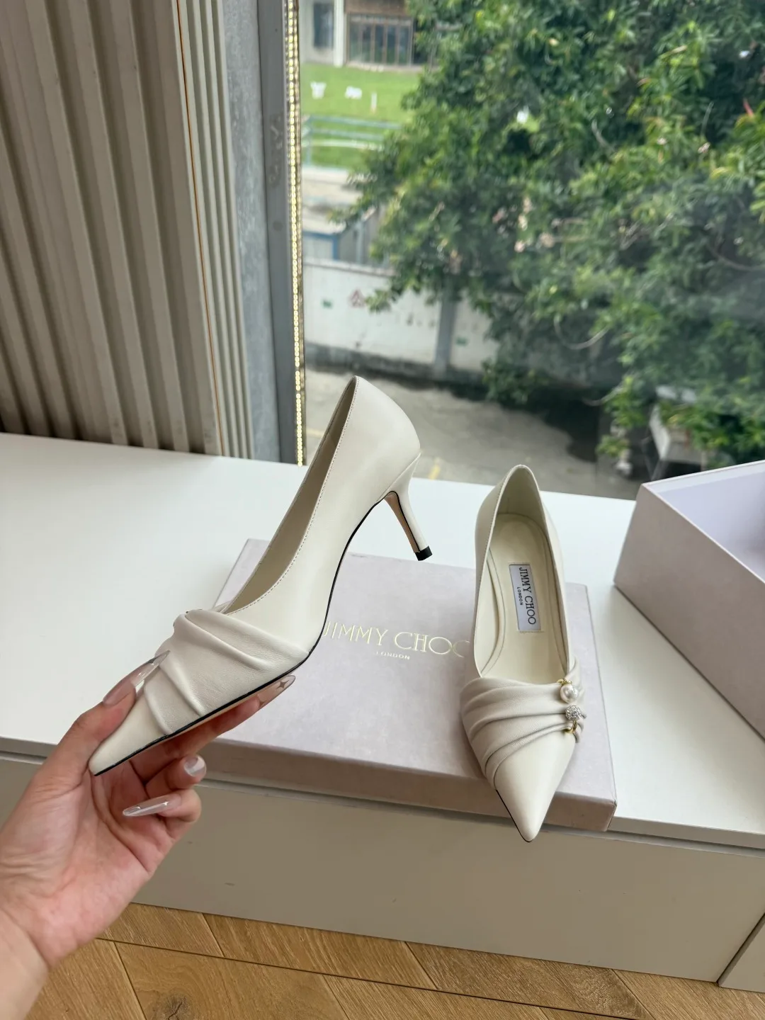Jimmy Choo Glossy Pointed-Toe Knotted Pointed Pumps in White · view 3