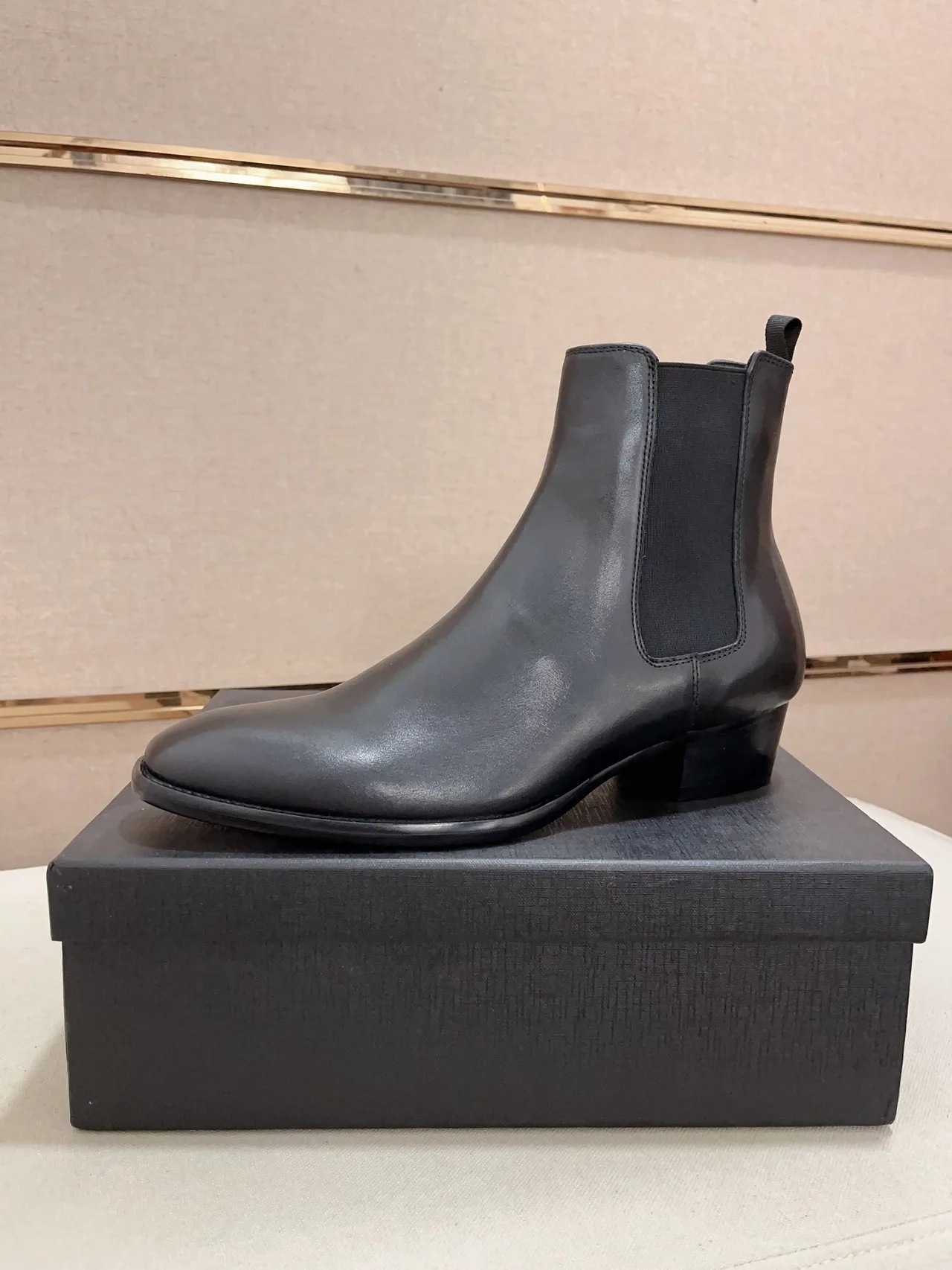 Saint Laurent Cowhide Glossy Pointed-Toe Chelsea Boots in Black · view 1