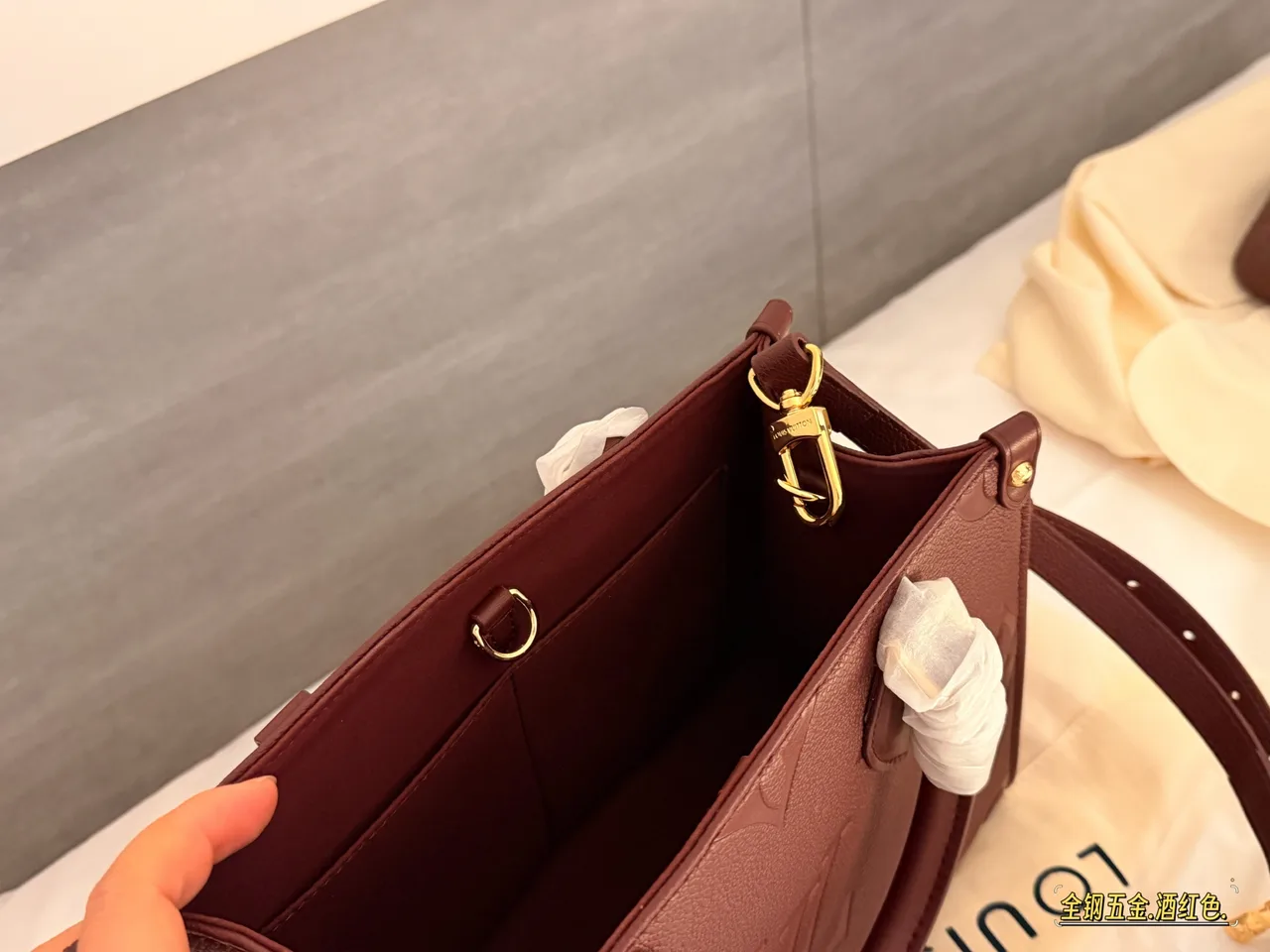 Louis Vuitton OnTheGo Embossed Monogram Zip-Compartment Tote in Burgundy · view 2