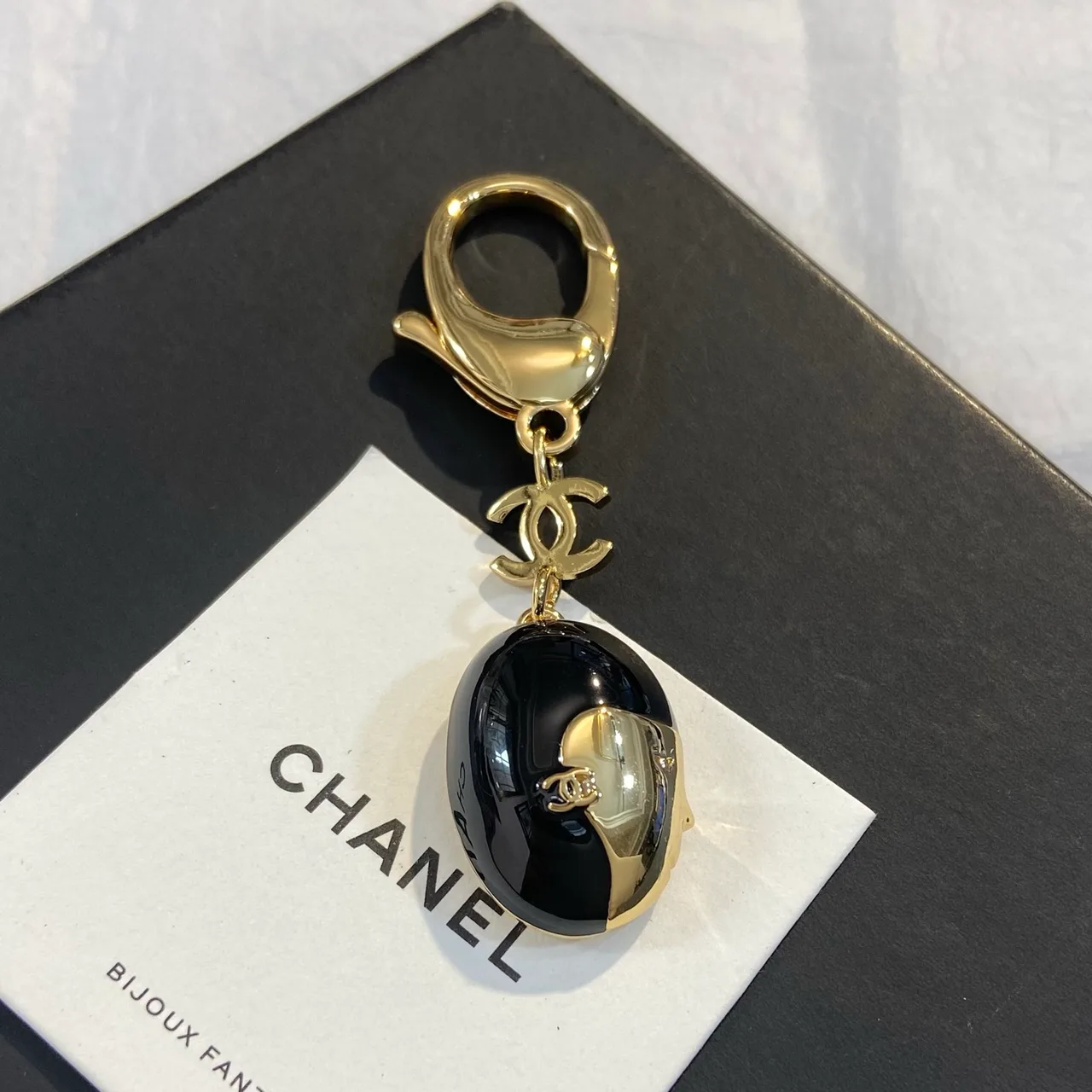 Chanel Face Keychain in Black · view 1