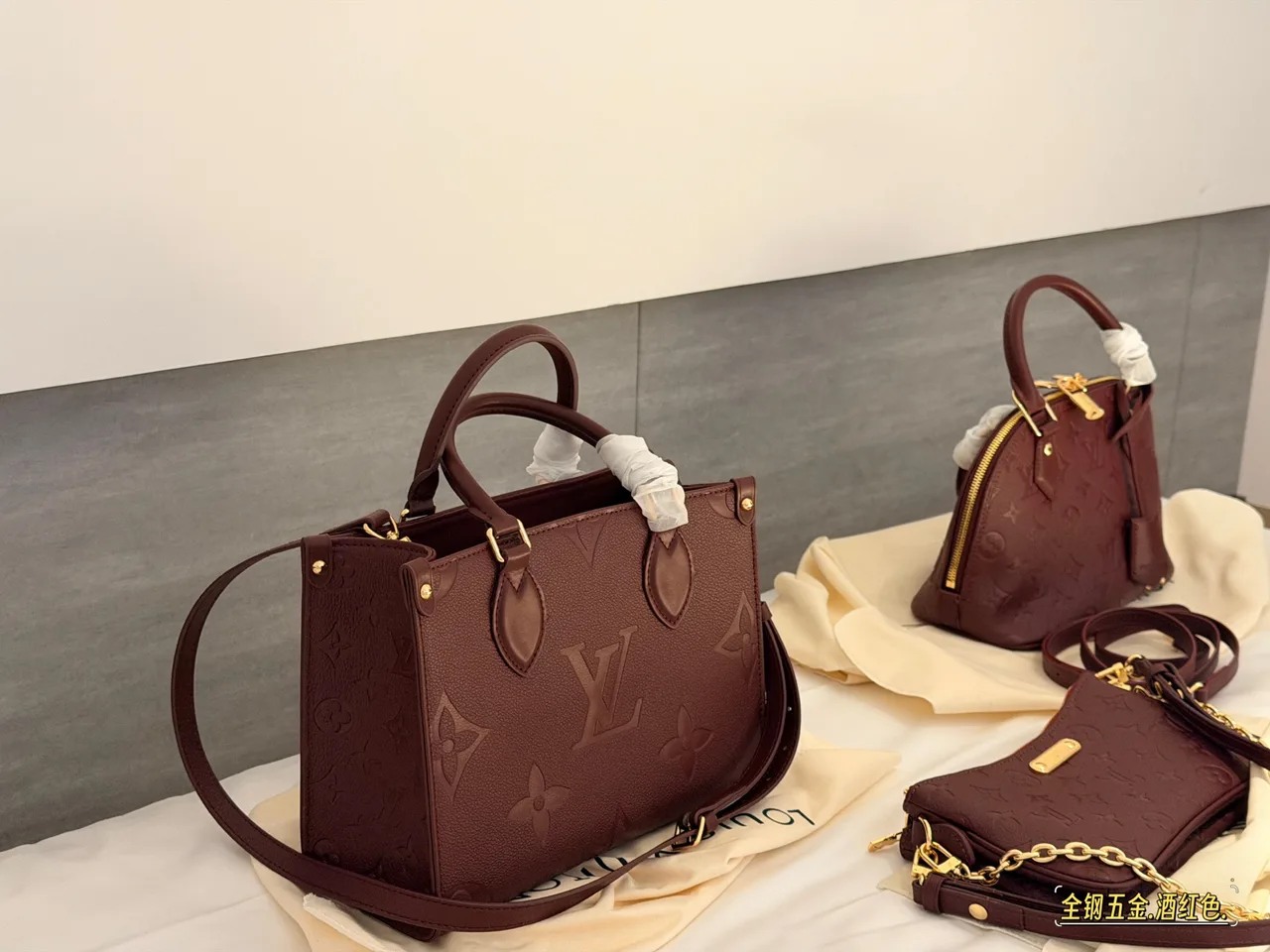 Louis Vuitton OnTheGo Embossed Monogram Zip-Compartment Tote in Burgundy · view 7
