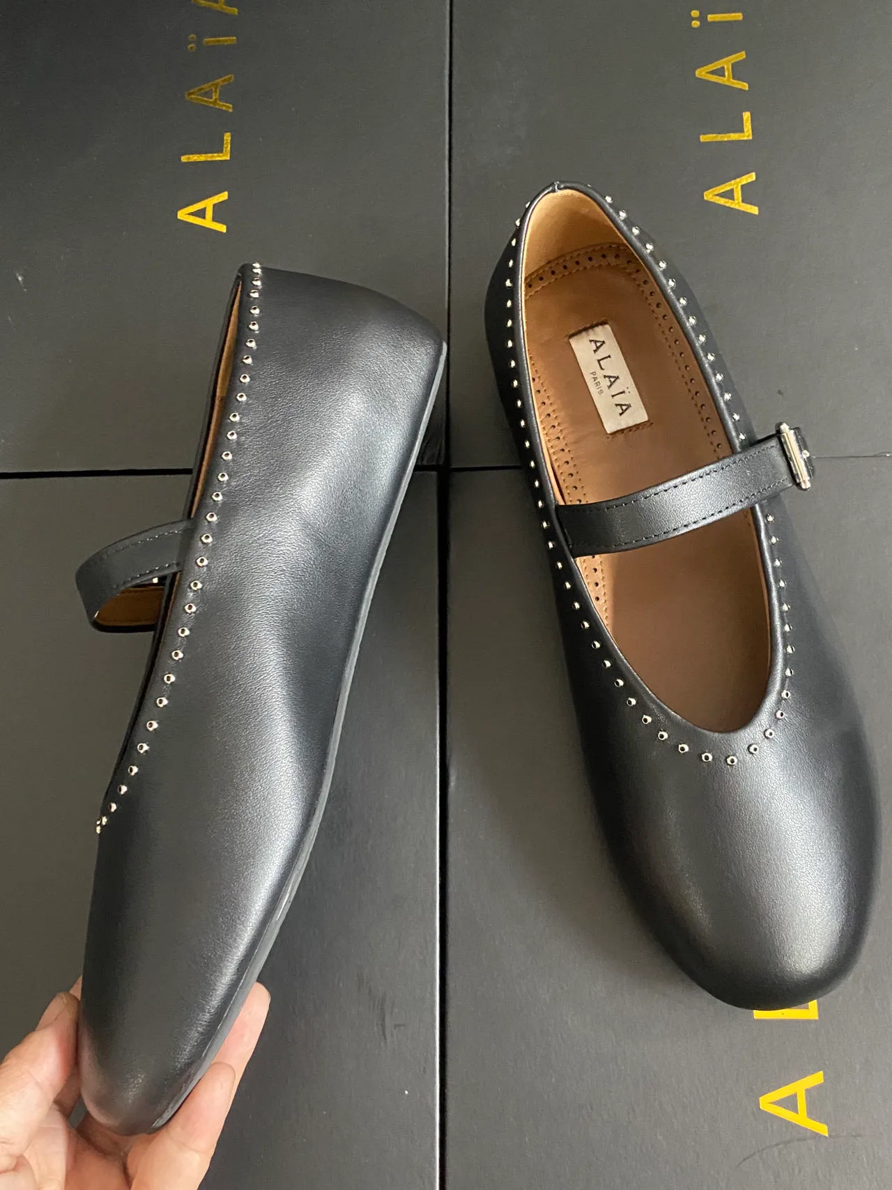 Alaia Cowhide Sheepskin Smooth Round-Toe Mary Jane Flats in Black · view 7