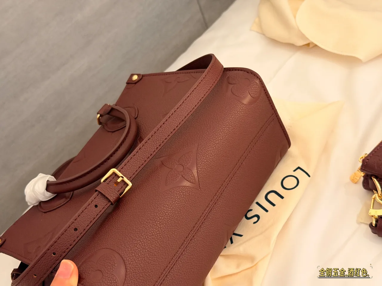 Louis Vuitton OnTheGo Embossed Monogram Zip-Compartment Tote in Burgundy · view 5