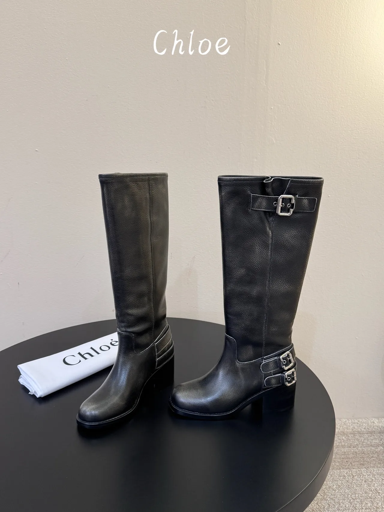 Cowhide Ribbed Glossy Round-Toe Triple-Buckle Knee-High Boots in Black · view 1