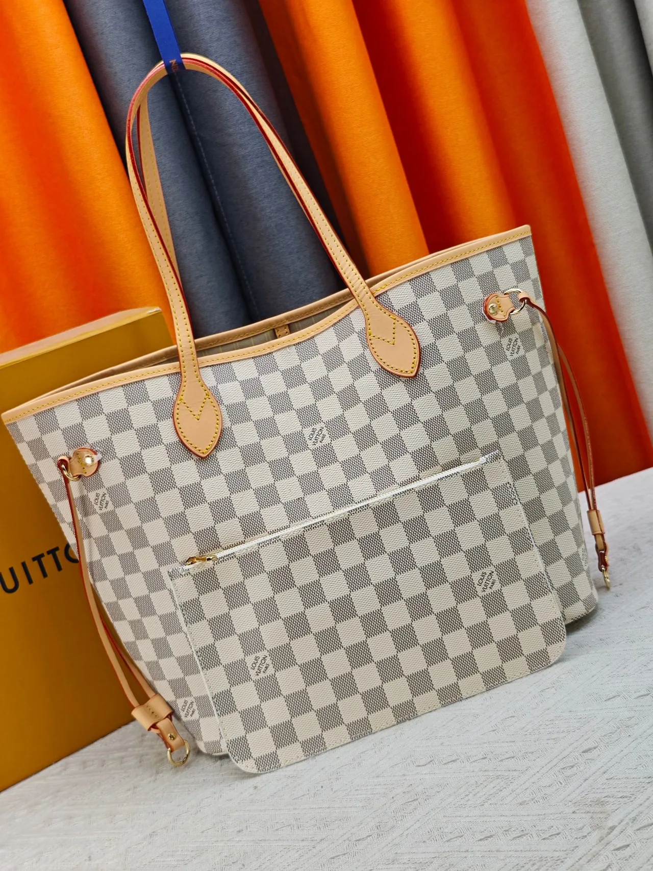 Louis Vuitton Neverfull Clutch in Grey · view 1