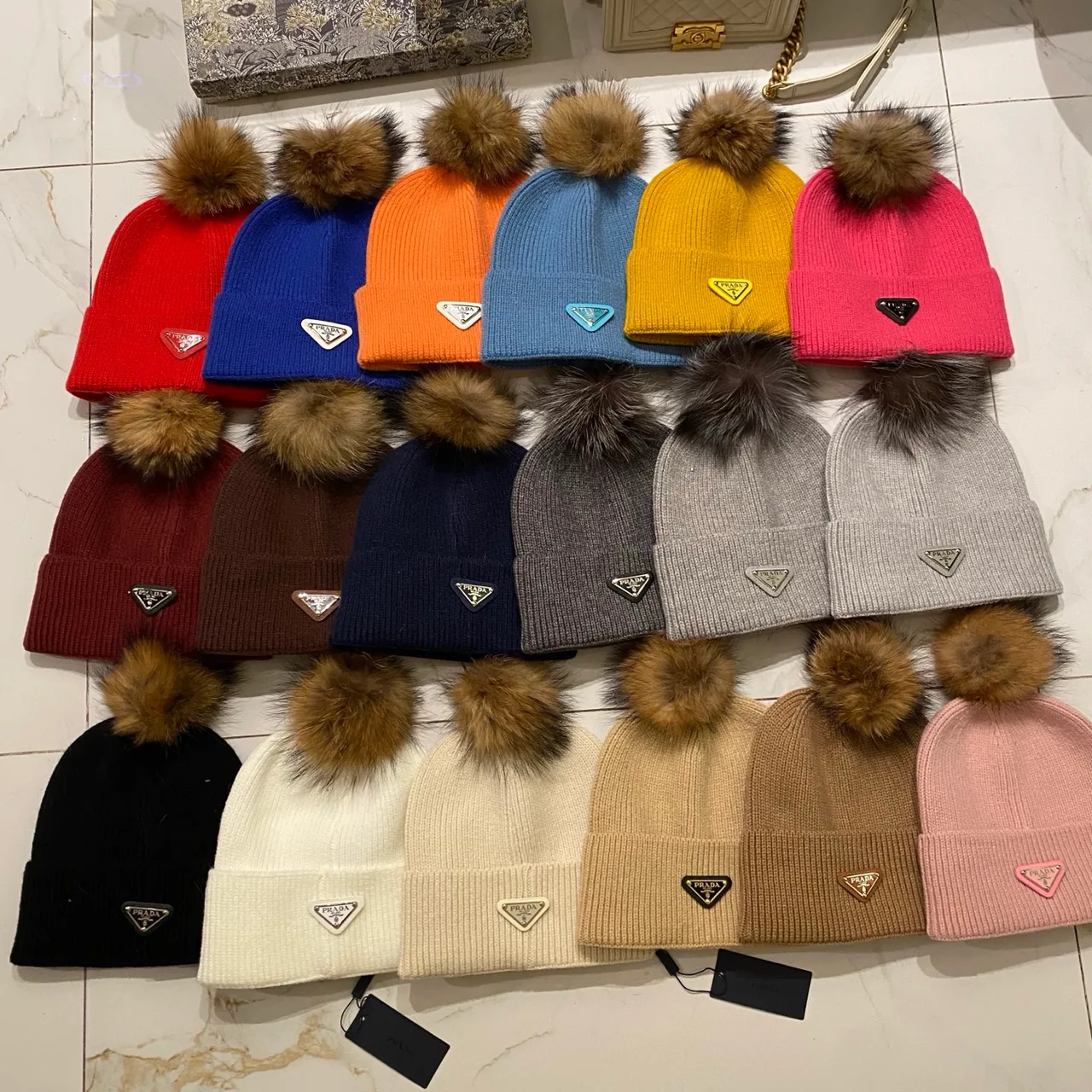Prada Pom Knit Beanie in Red & Blue & Orange & Yellow & Pink & Brown & Grey & Black & White & Beige · view 1