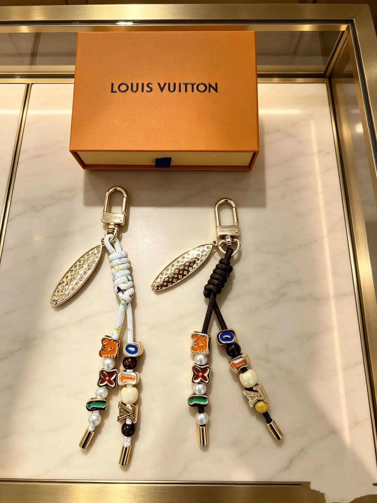 Louis Vuitton Braided Keychain in White & Black · view 1