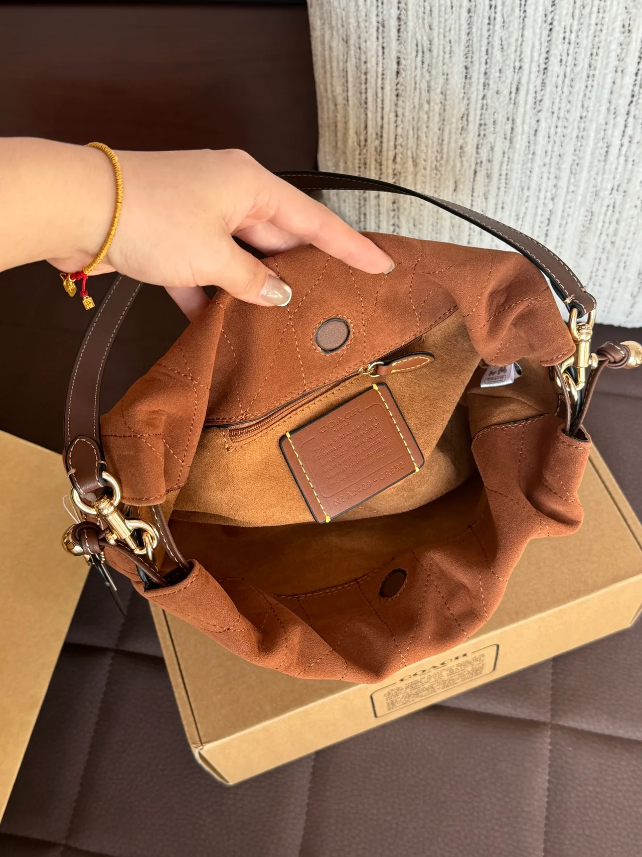 Quilted Suede-Look Drawstring Shoulder Bag in Brown · view 8
