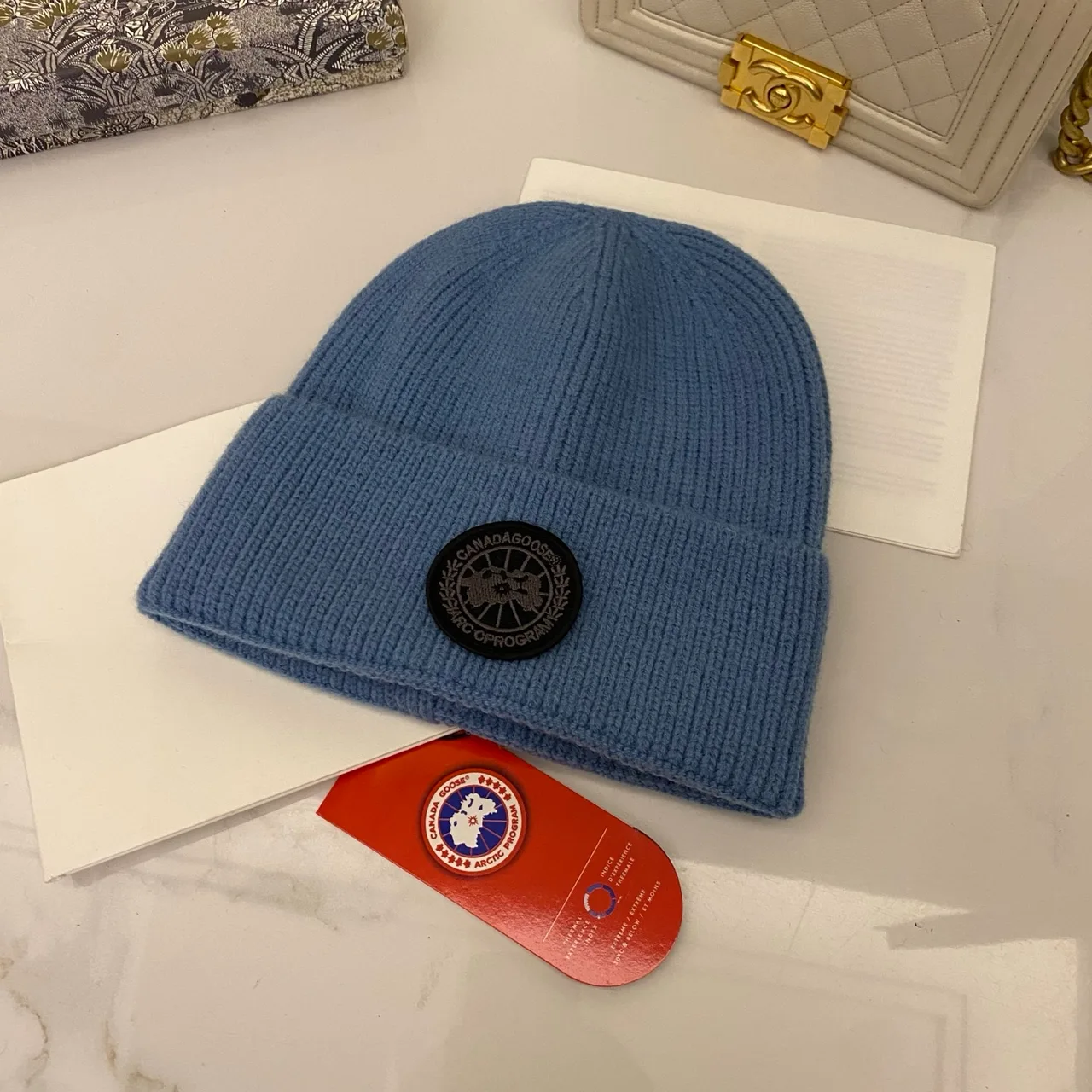 Canada Goose Logo knit beanie in Red & Blue & Yellow & Orange & Pink & Grey & White & Black & Tan & Cream · view 5