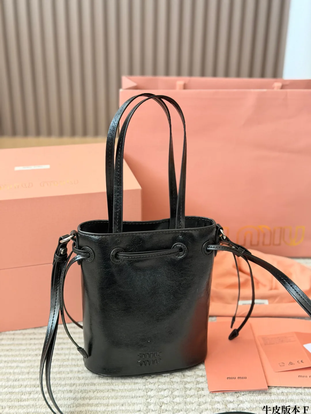 Miu Miu Cowhide Bucket Bag in Black · view 2