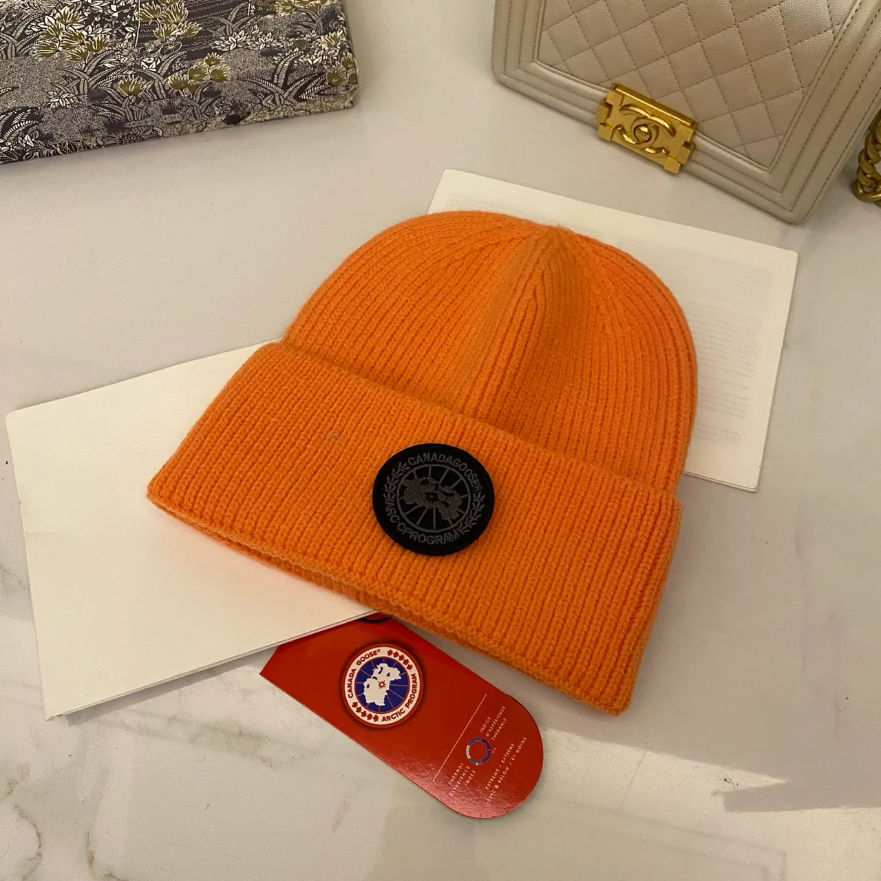 Canada Goose Logo knit beanie in Red & Blue & Yellow & Orange & Pink & Grey & White & Black & Tan & Cream · view 3