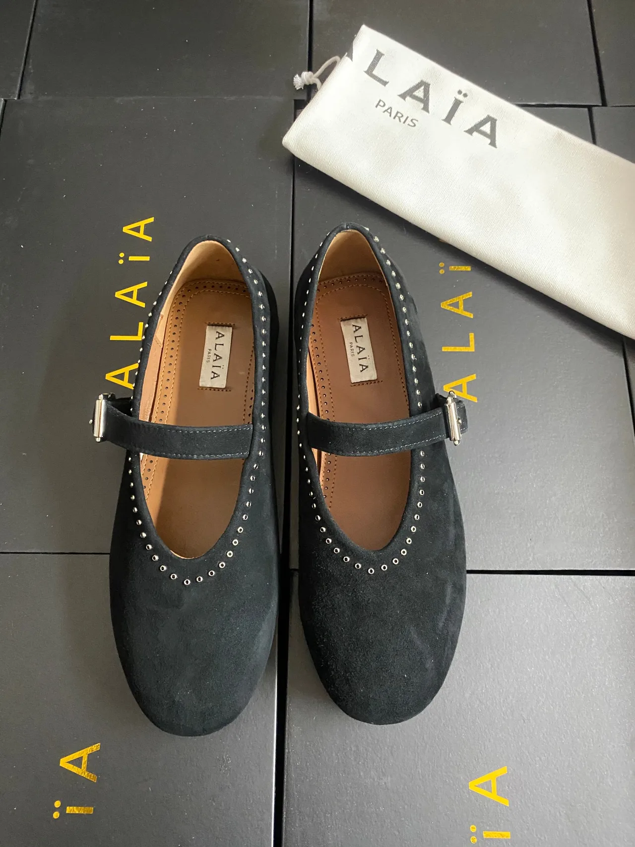 Alaia Cowhide Sheepskin Suede-Look Buckle Ballet Flats in Black · view 1