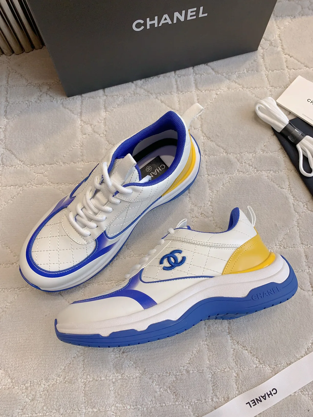 Chanel Quilted Sneakers in White · view 4