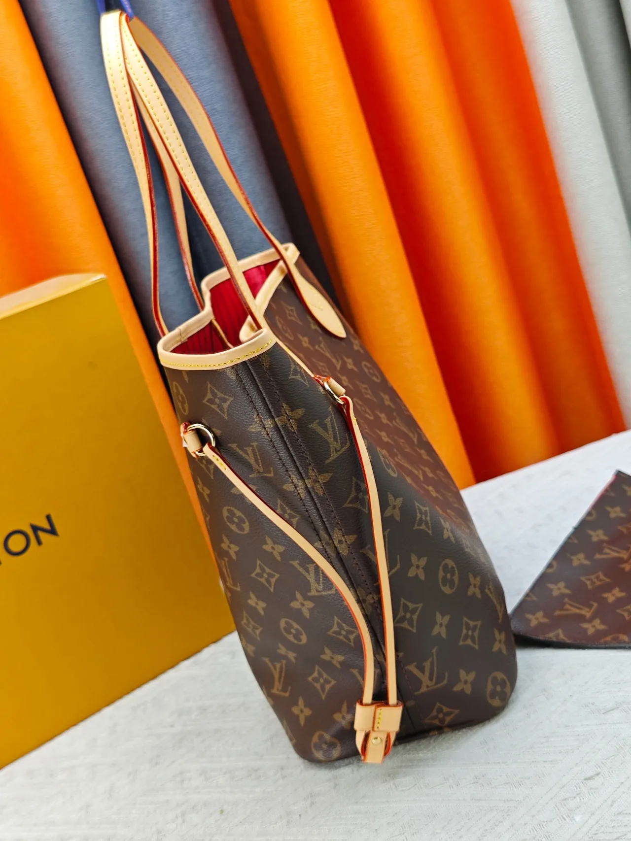 Louis Vuitton Neverfull Clutch in Brown · view 3