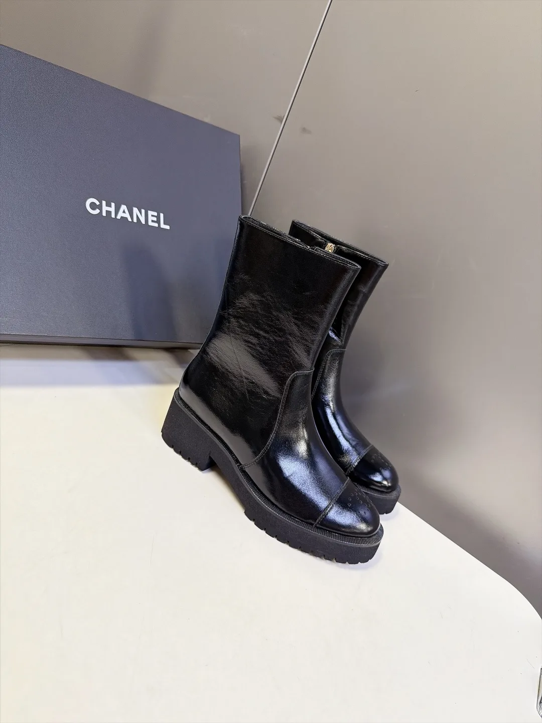 Chanel Cowhide Patent Leather Glossy Round-Toe Ankle Boots in Black · view 2