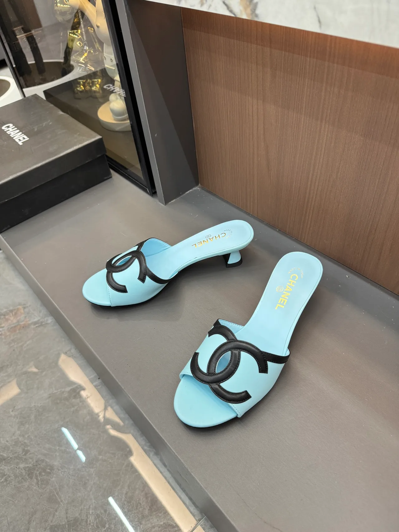 Chanel CC Cutout Heeled Mules in Blue / Pink / White / Yellow · view 1