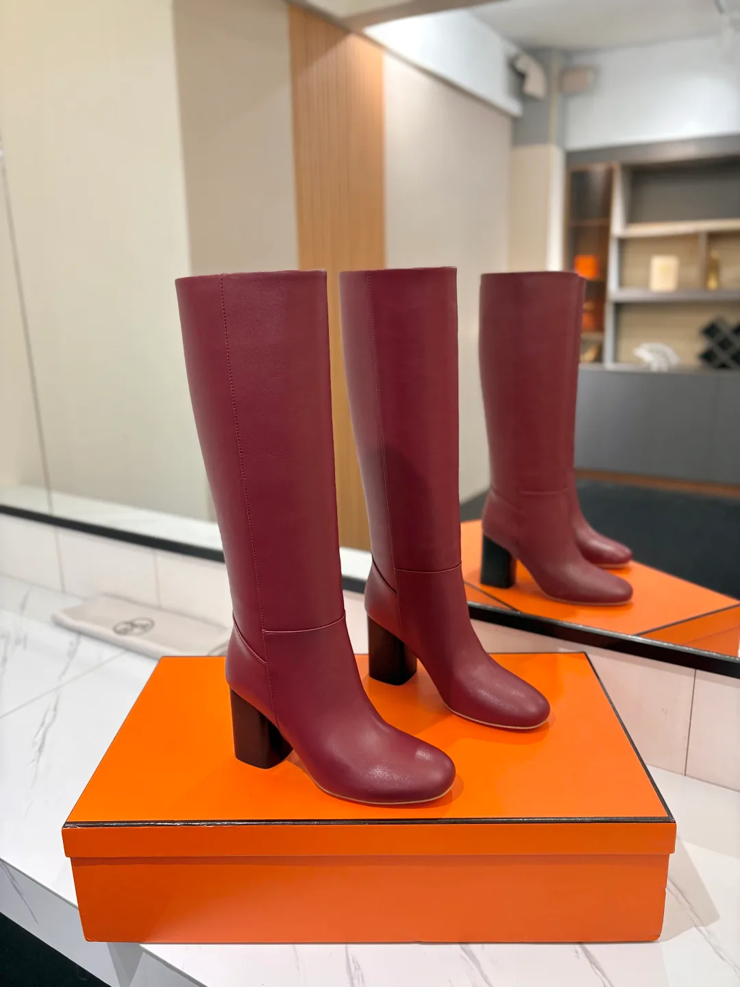 Hermes Cowhide Knee-High Boots in Burgundy · view 1