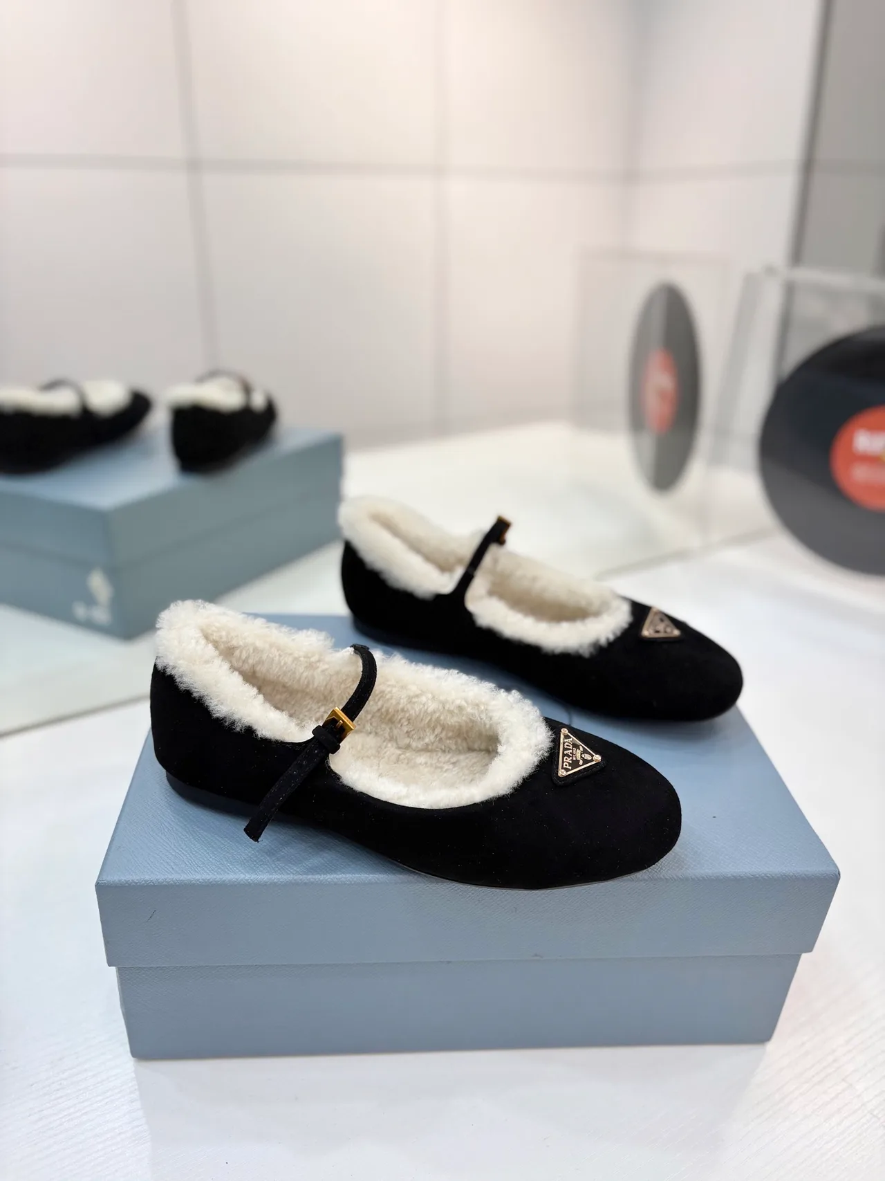 Prada Buckle Fur-Lined Mary Jane Flats in Black · view 1