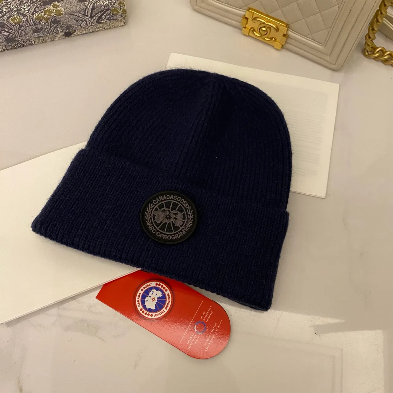 Canada Goose Logo knit beanie in Red & Blue & Yellow & Orange & Pink & Grey & White & Black & Tan & Cream · view 4