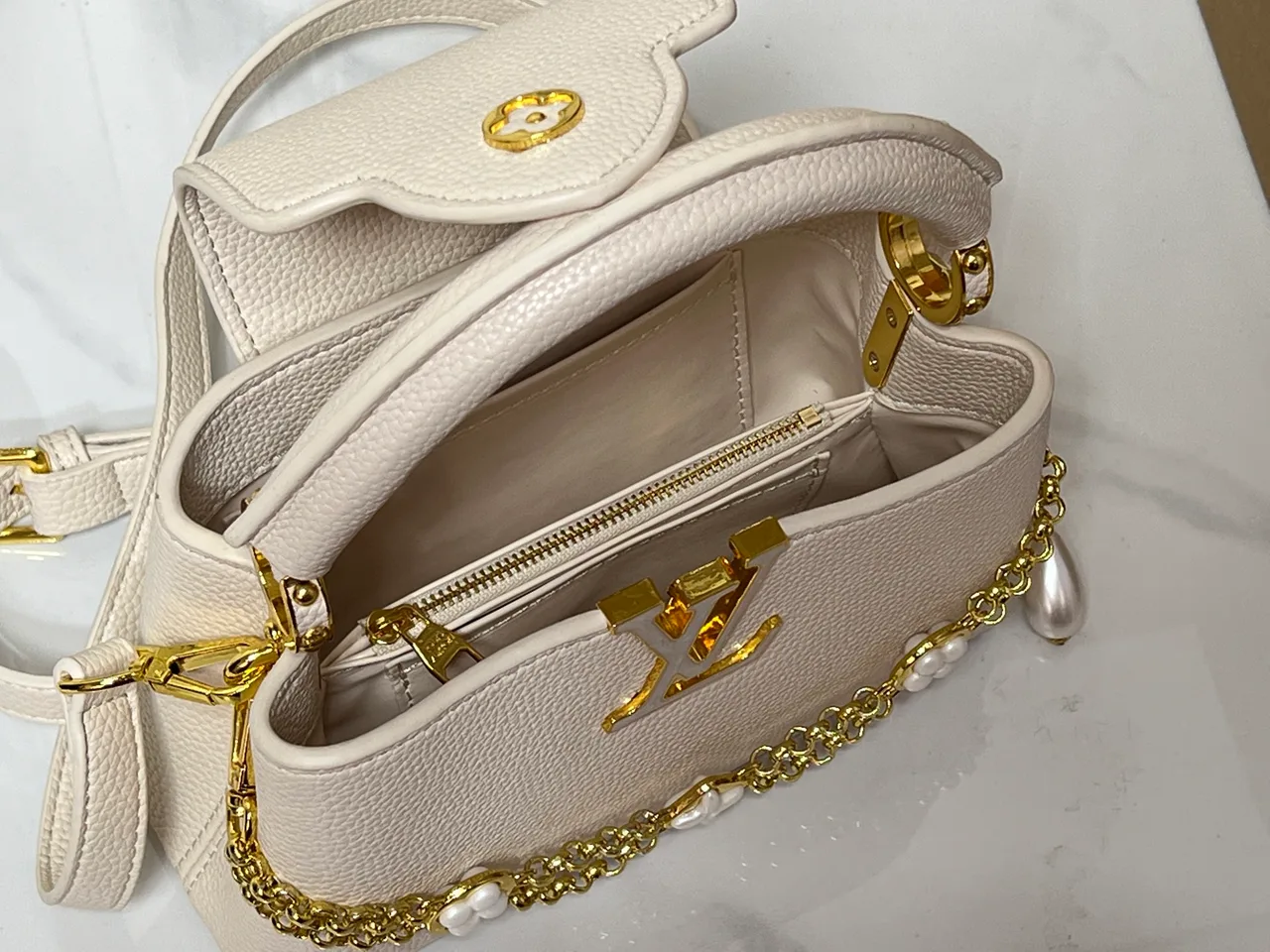 Louis Vuitton Cowhide Smooth Capucines East West Bag in Cream · view 8