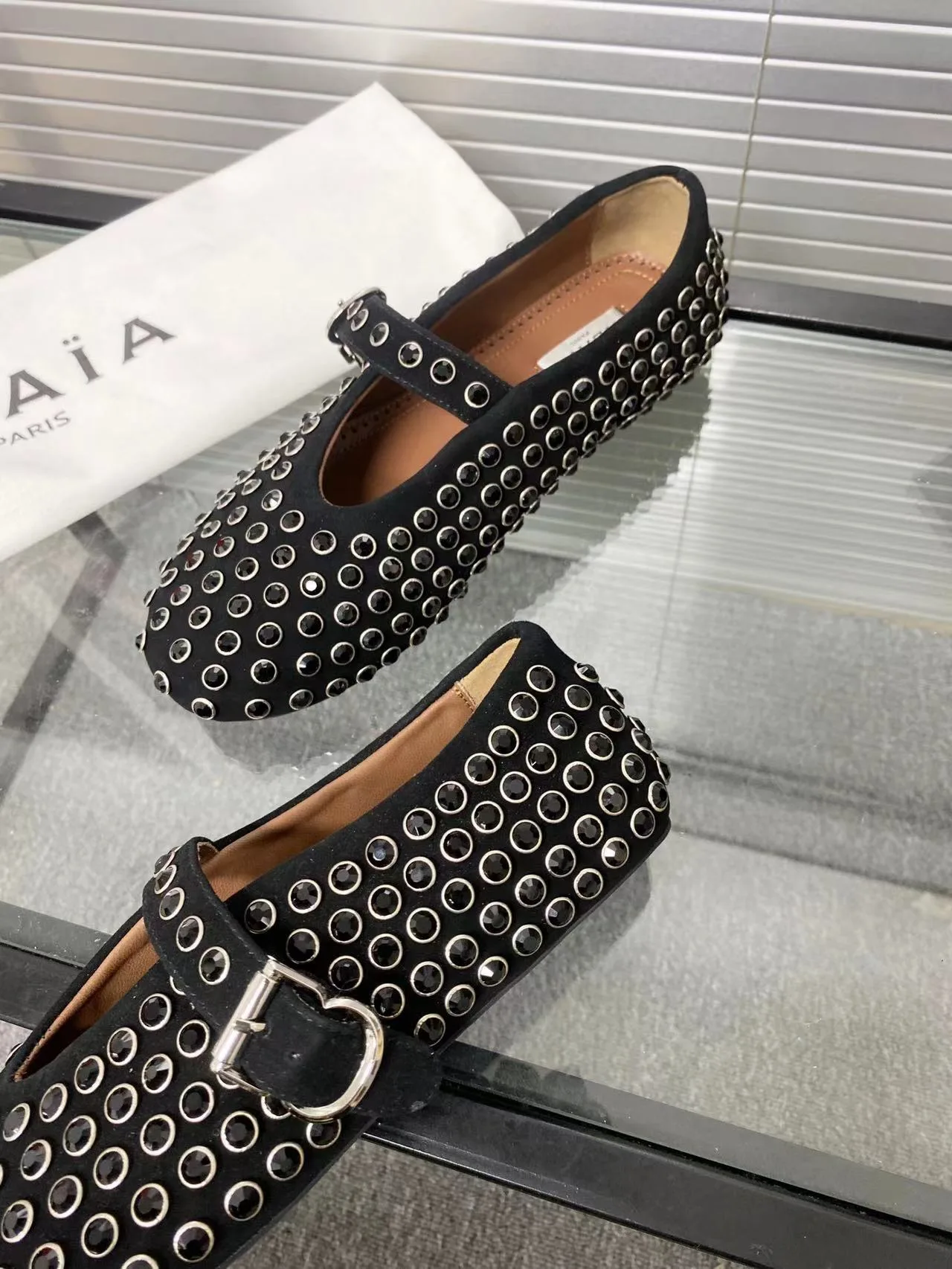 Alaia Cowhide Sheepskin Round-Toe Studded Mary Jane Flats in Black · view 6