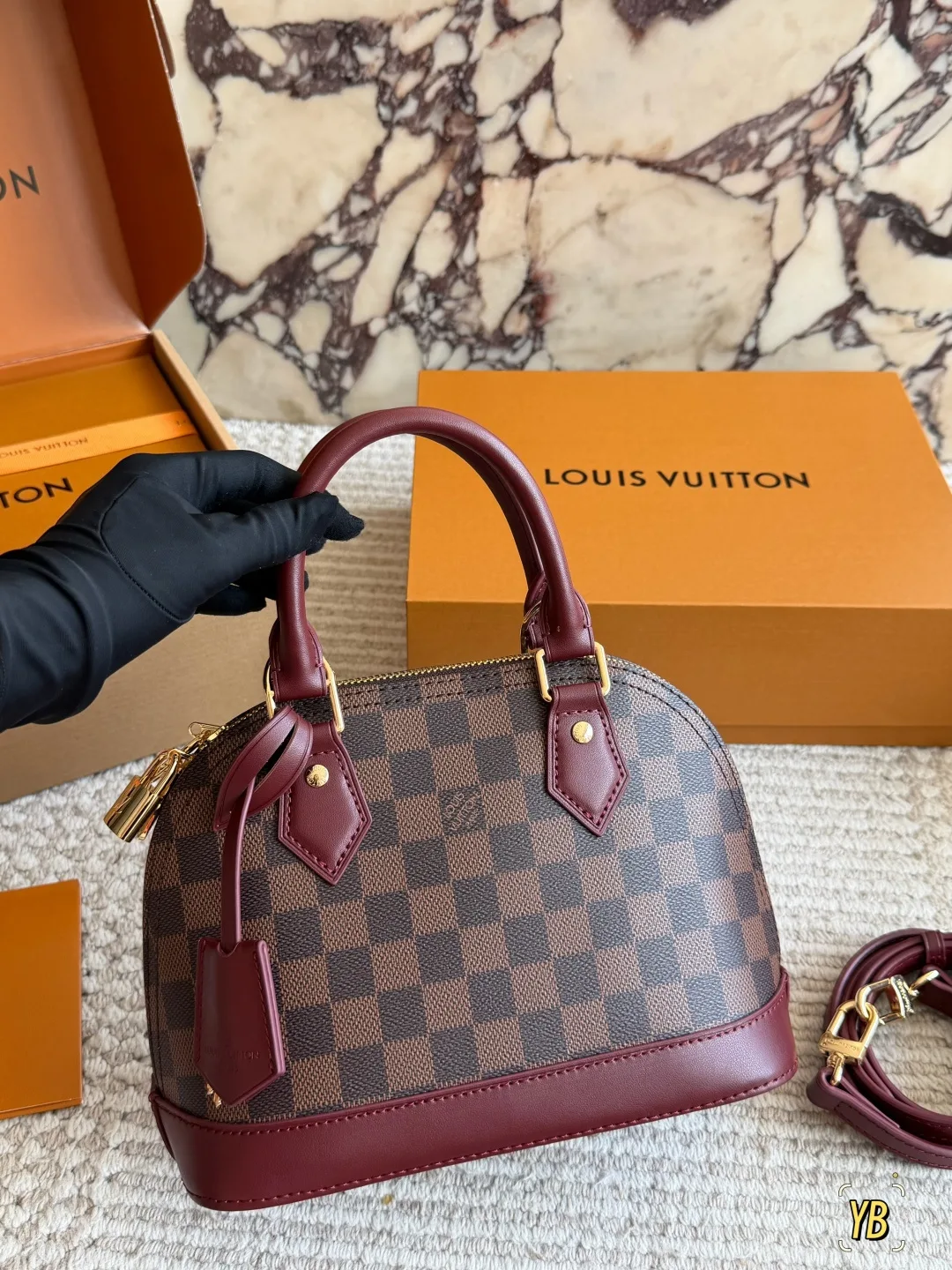 Louis Vuitton Cowhide Check Handbag in Brown · view 1