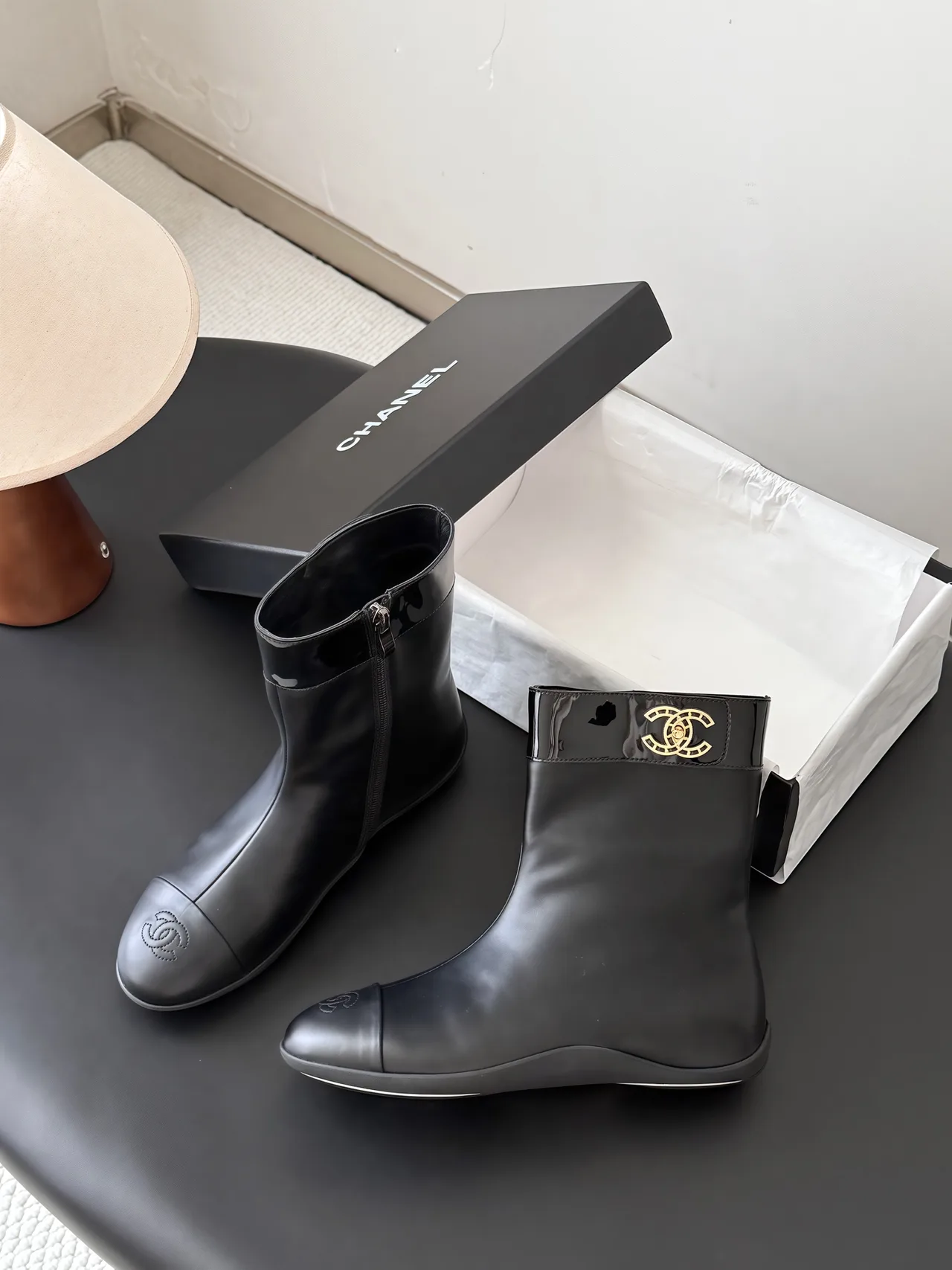 Chanel Cowhide Glossy Round-Toe Boots in Black · view 2