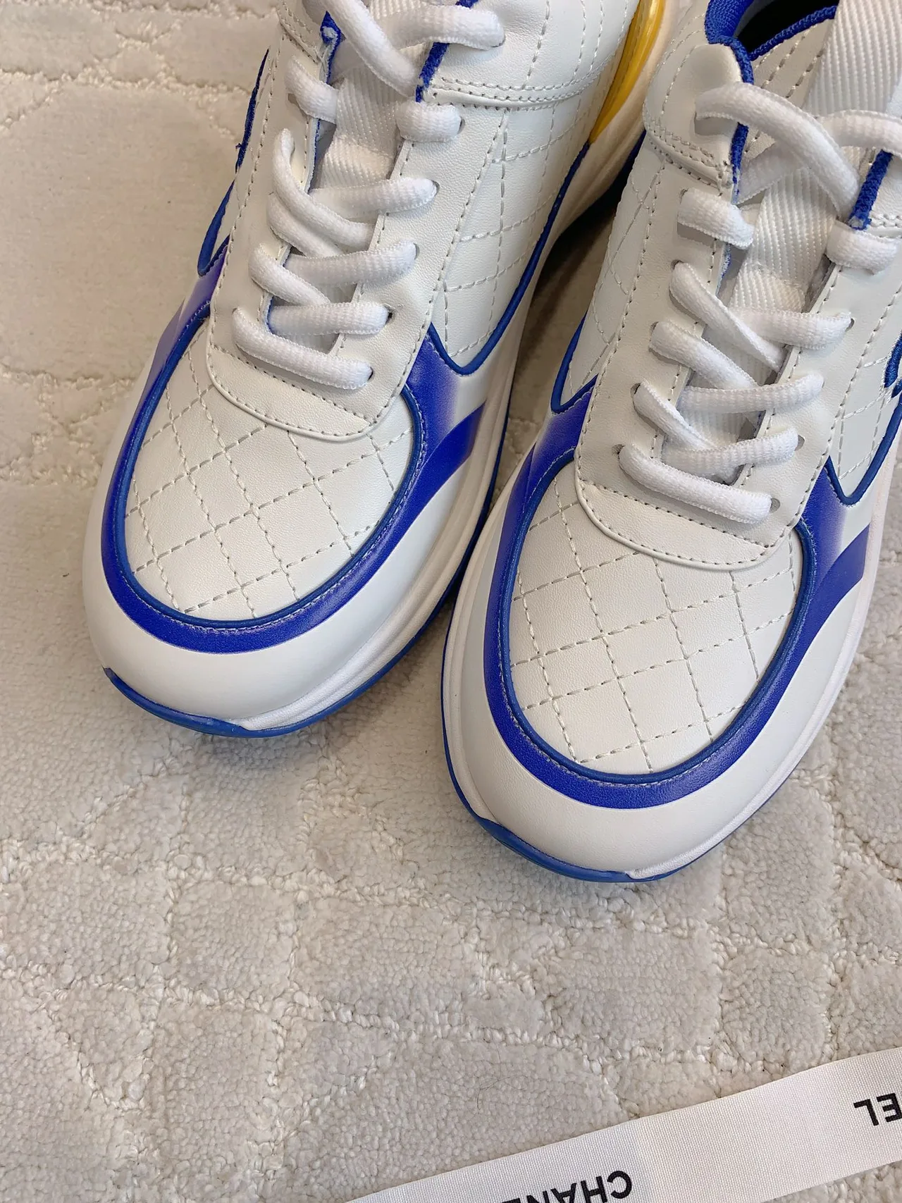 Chanel Quilted Sneakers in White · view 5