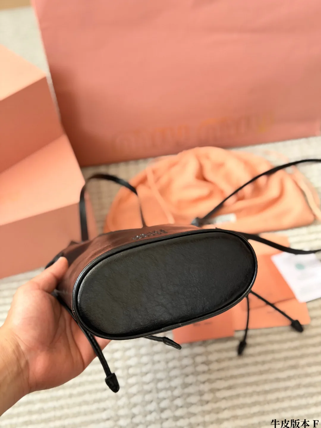 Miu Miu Cowhide Bucket Bag in Black · view 6