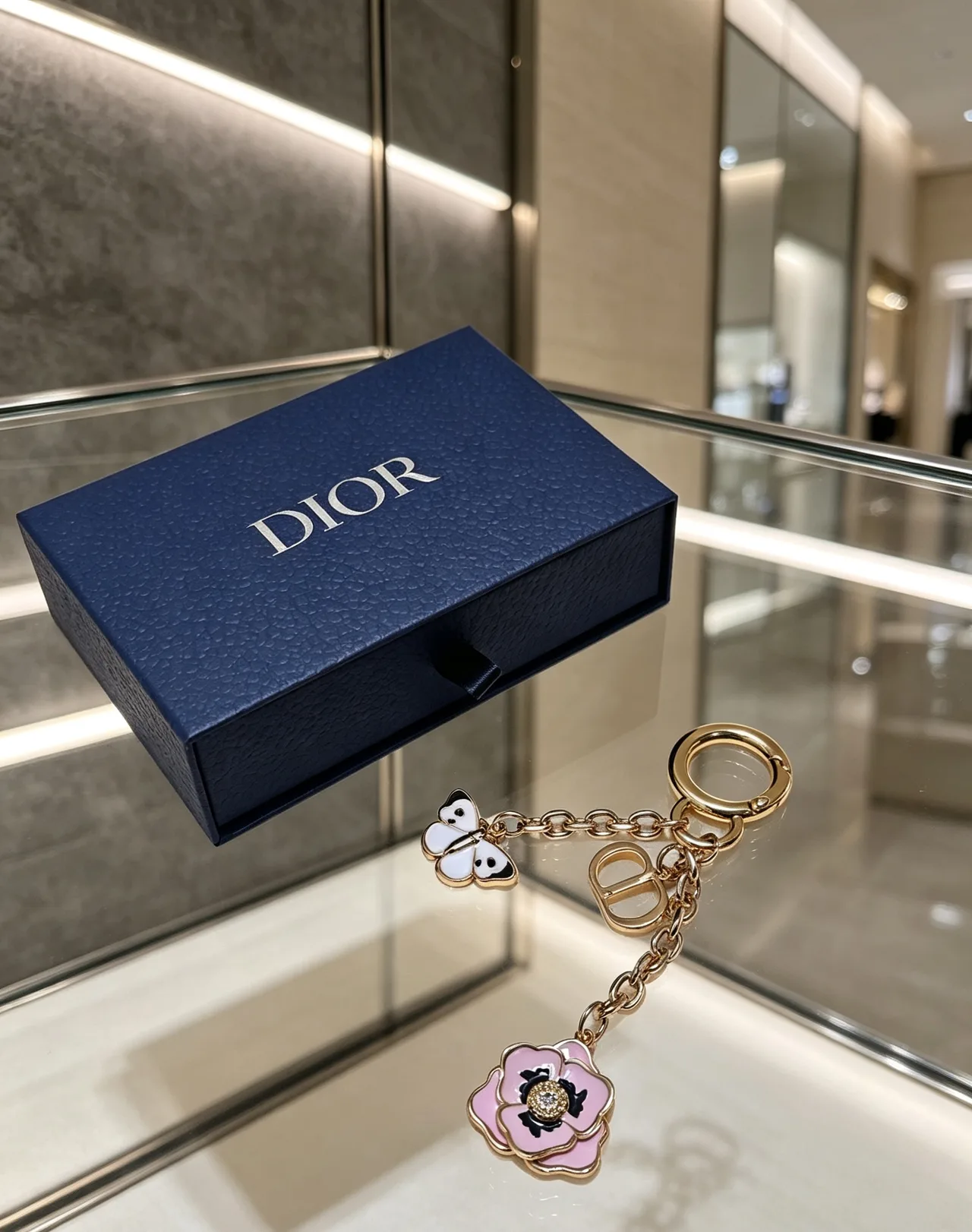 Dior Butterfly and Flower Keychain in Gold · view 1
