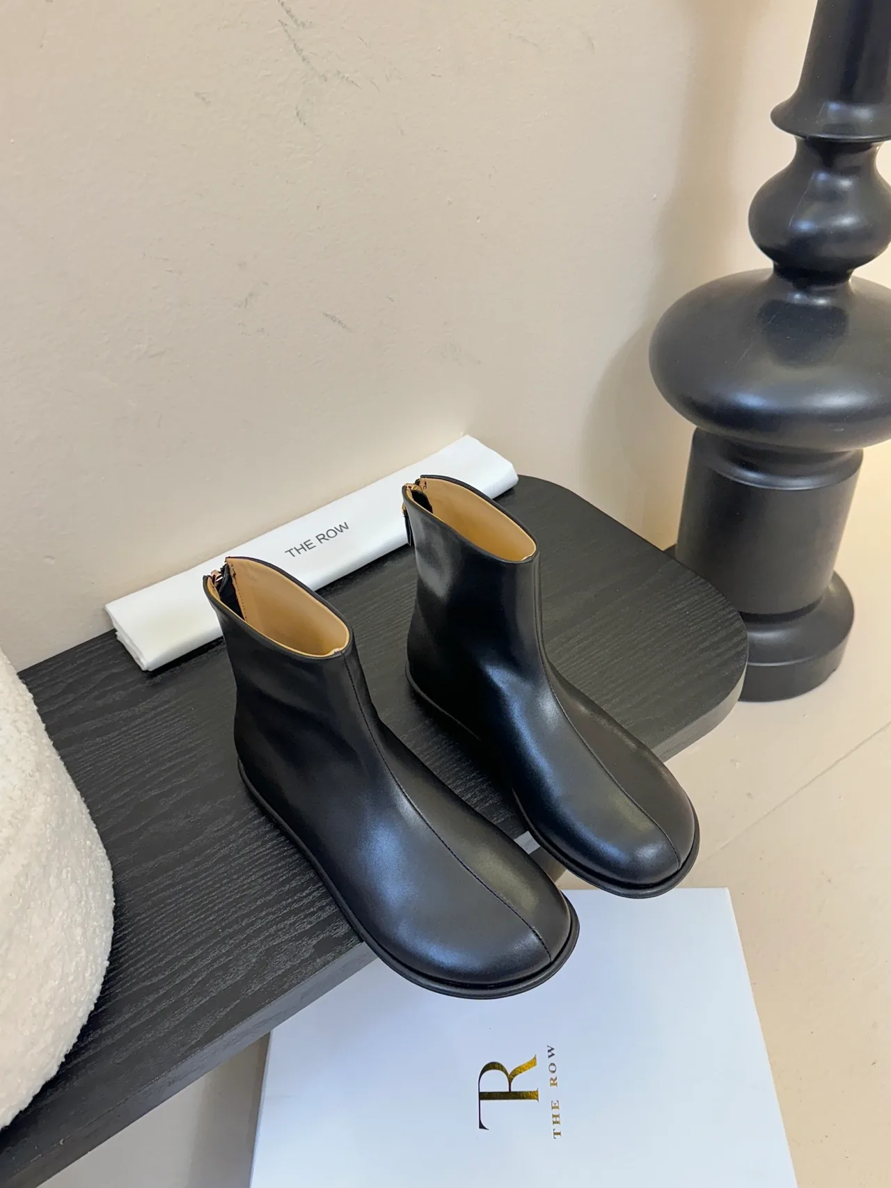 The Row Cowhide Glossy Round-Toe Ankle Boots in Black · view 1